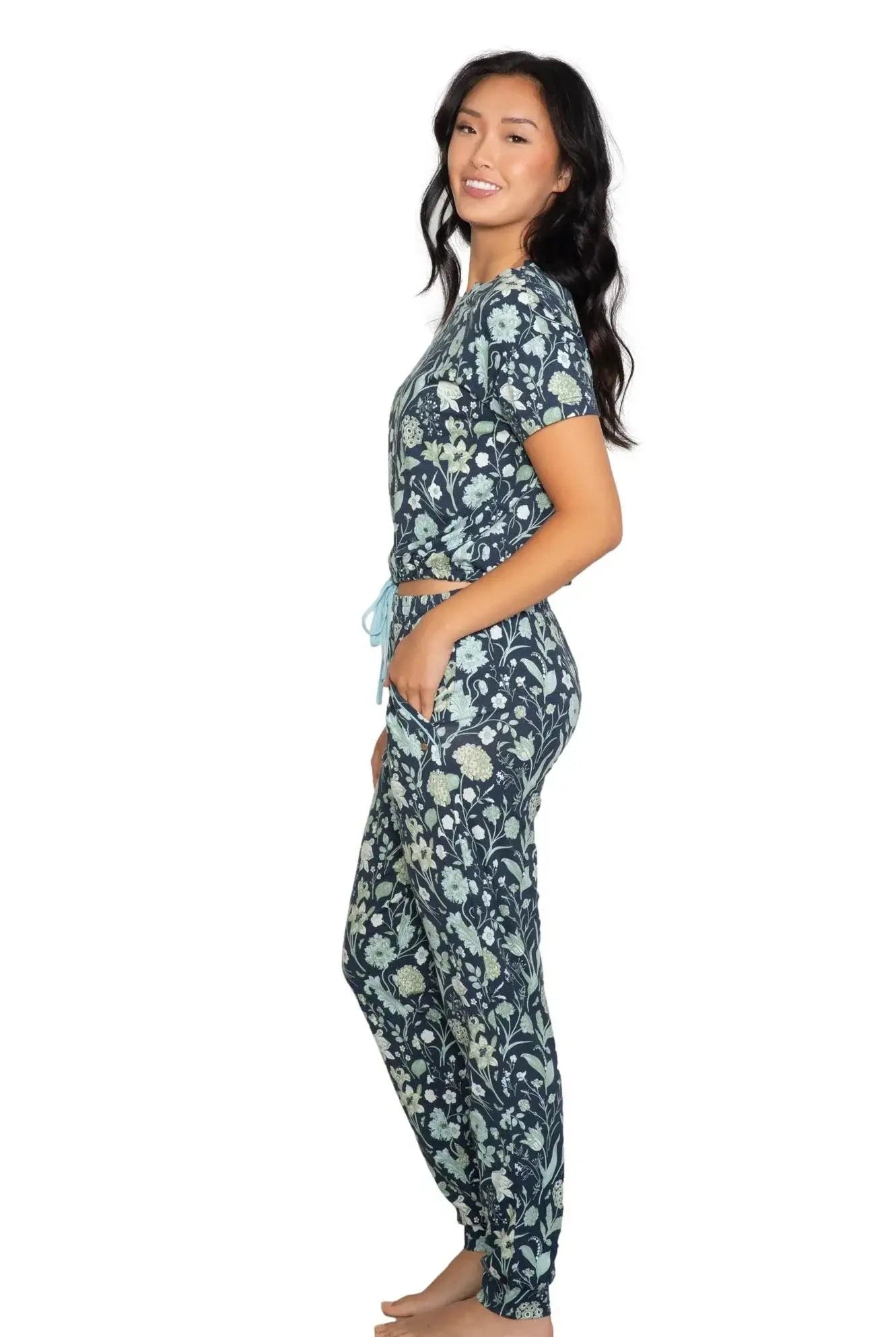 Latte Love Floral Print Cotton-Modal Relaxed Set Drop Shoulder Tee & Jogger Set modeled by a woman in profile.