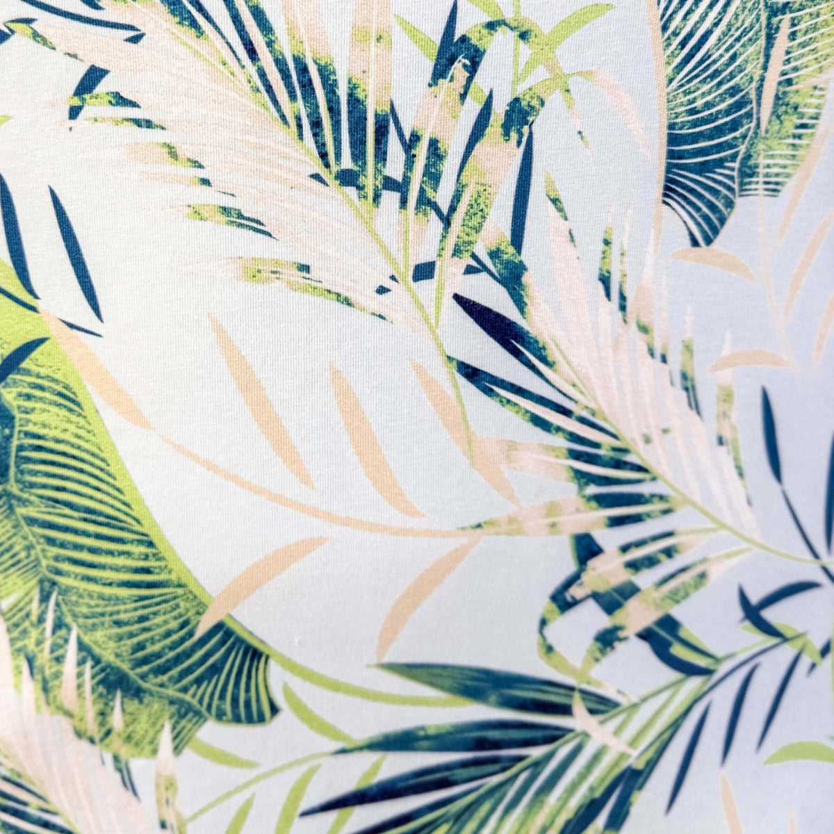 Tropical leaf pattern with green, blue, and beige leaves on a light blue background, Light Blue Leaves print by Latte Love
