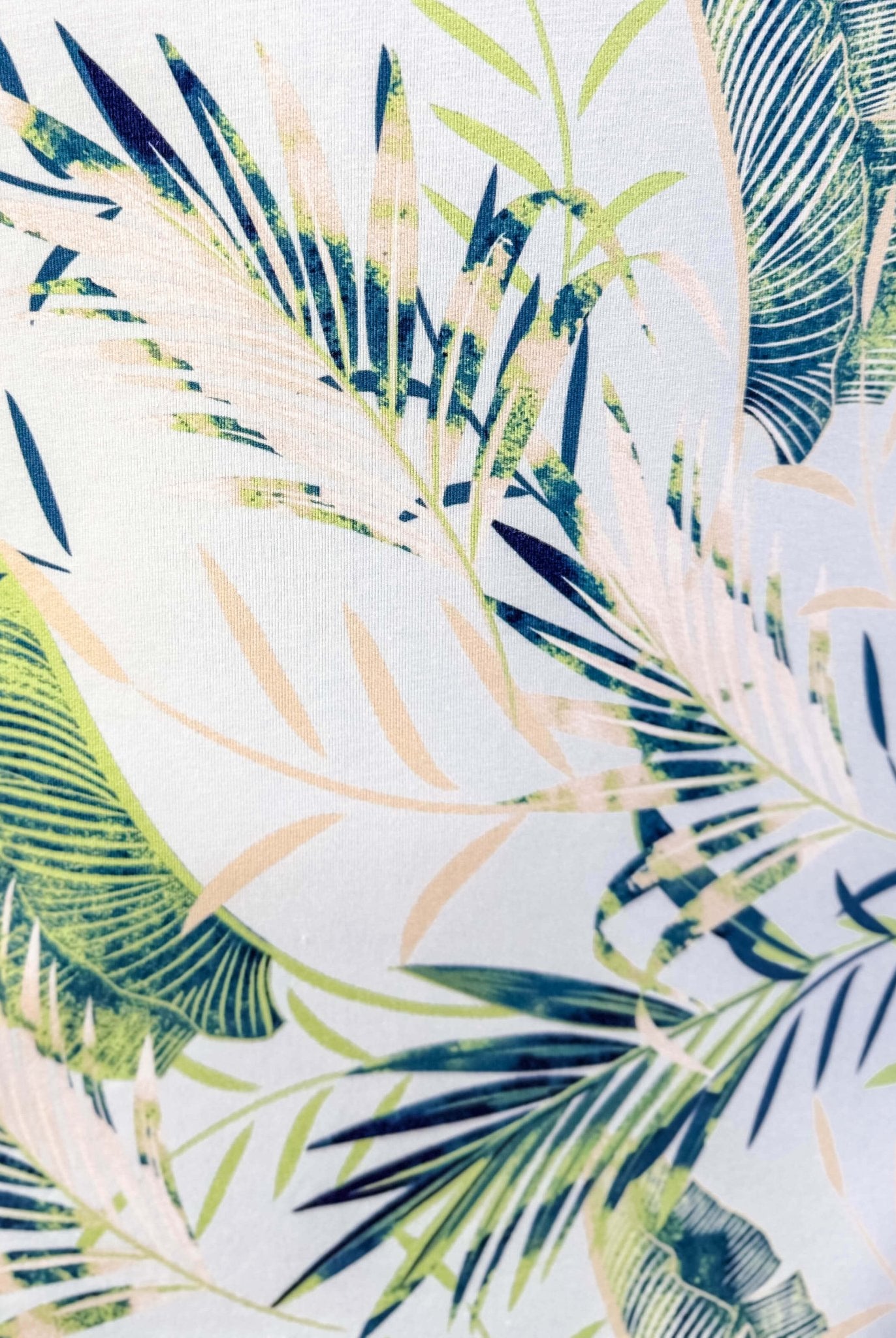 Tropical leaf pattern with green, blue, and beige leaves on a light blue background, Light Blue Leaves print by Latte Love