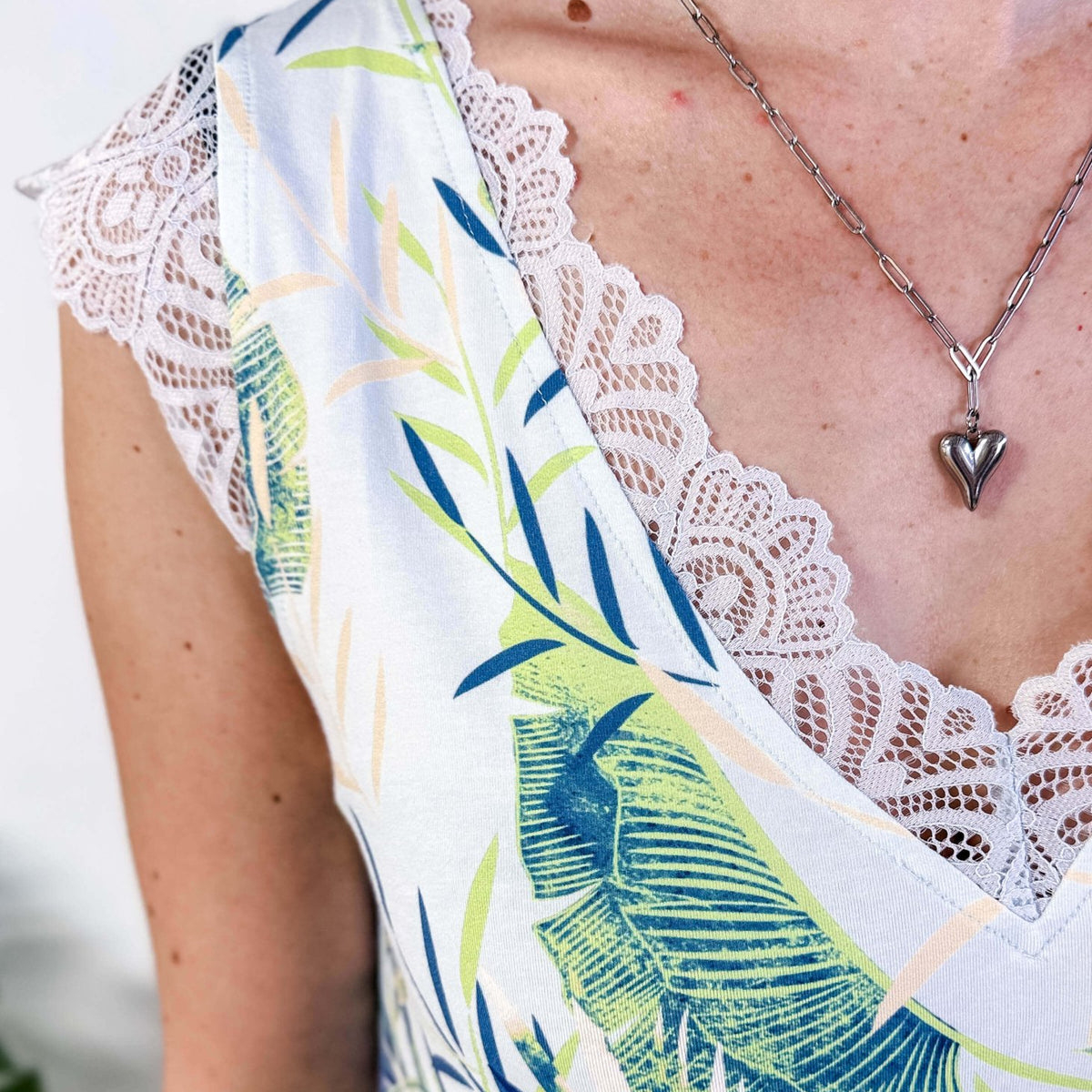 LATTE LOVE — Lace Sleep Dress in Light Blue Leaves worn on model in bedroom setting showing closeup detail of the lave and print
