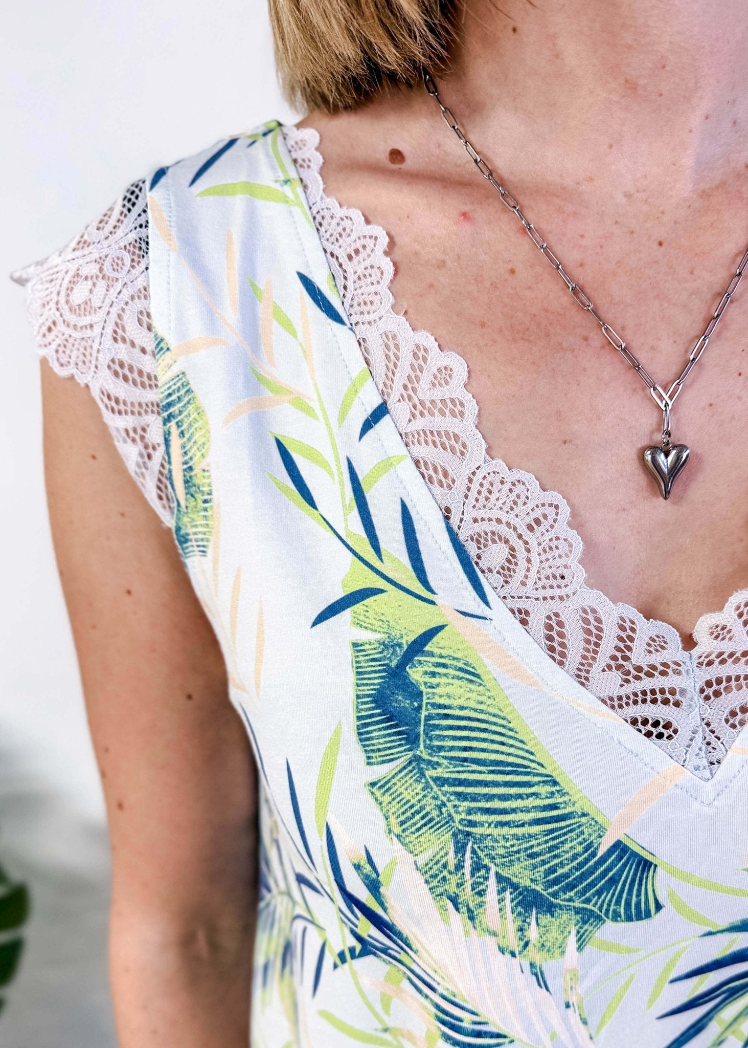 LATTE LOVE — Lace Sleep Dress in Light Blue Leaves worn on model in bedroom setting showing closeup detail of the lave and print