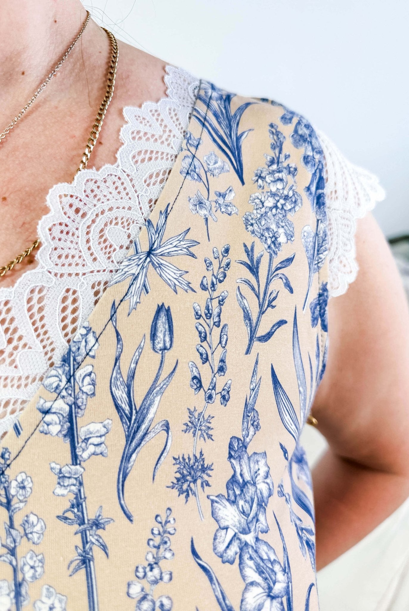 LATTE LOVE — Lace Sleep Dress in Linen Garden worn on model in bedroom setting, showing close up of the lace and floral pattern
