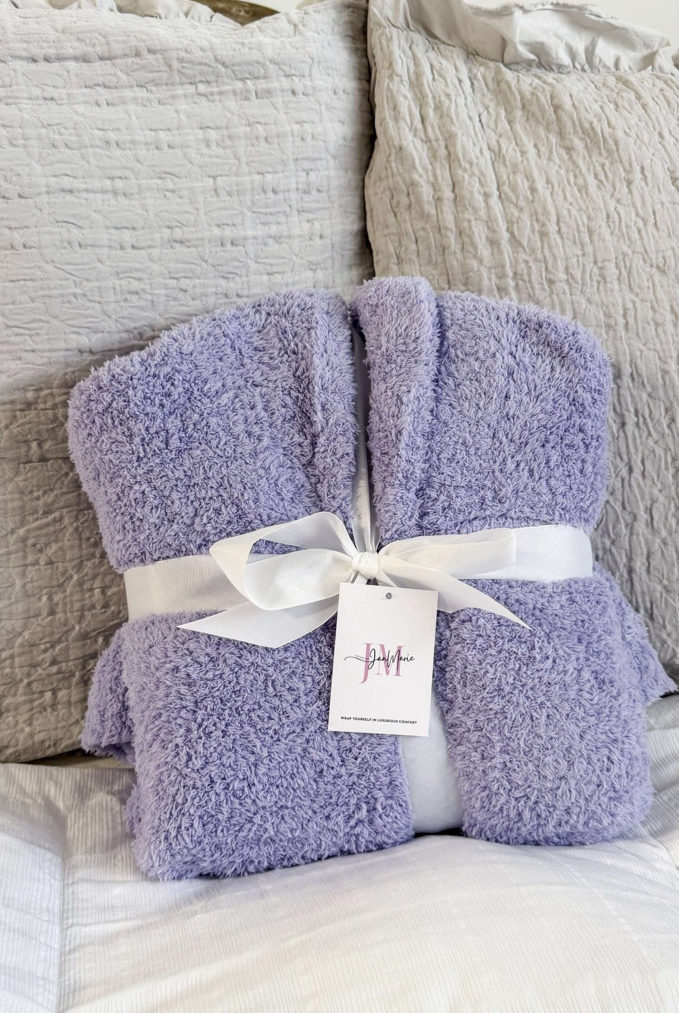 Lavender Chenille Cloud Spa Robe – Plush Stretch Robe with Pockets showing gift presentation, robe is wrapped with a white fabric ribbon and folded in a neat square.