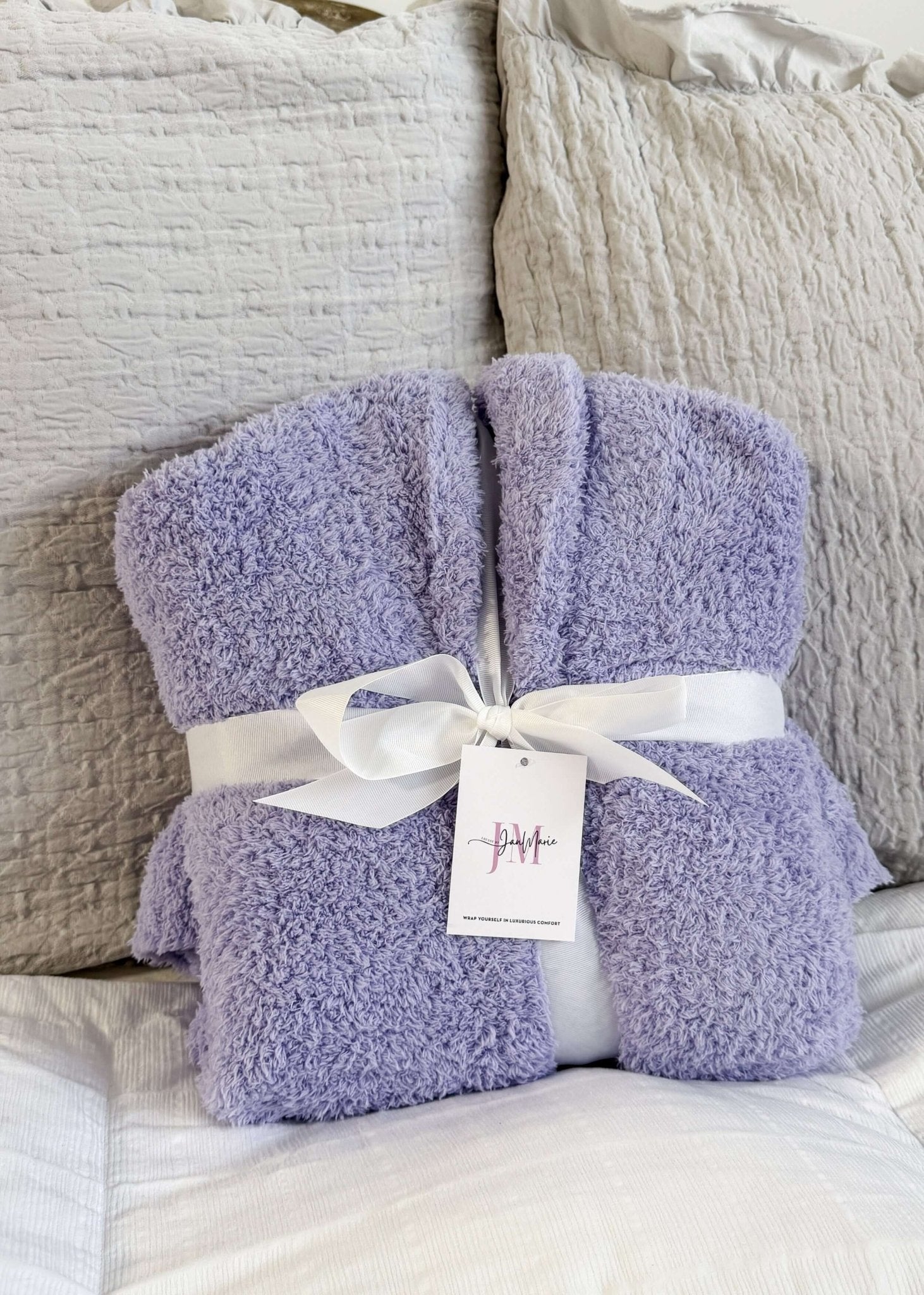 Lavender Chenille Cloud Spa Robe – Plush Stretch Robe with Pockets showing gift presentation, robe is wrapped with a white fabric ribbon and folded in a neat square.