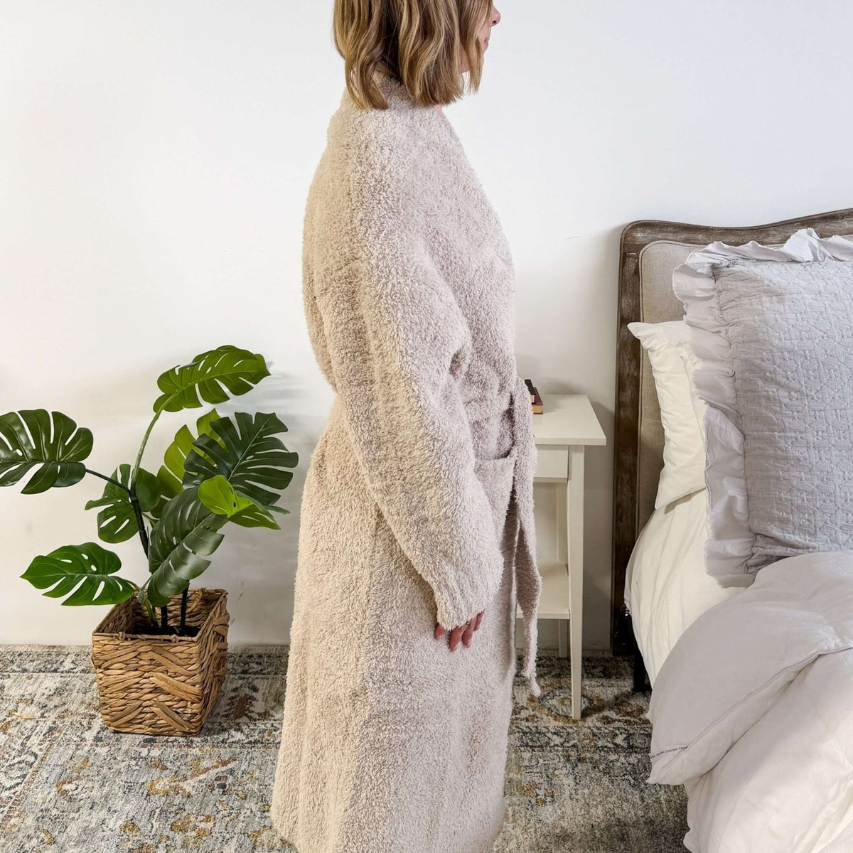 Sand Beige Chenille Cloud Spa Robe – Plush Stretch Robe with Pockets side profile shot on model standing in a bedroom setting