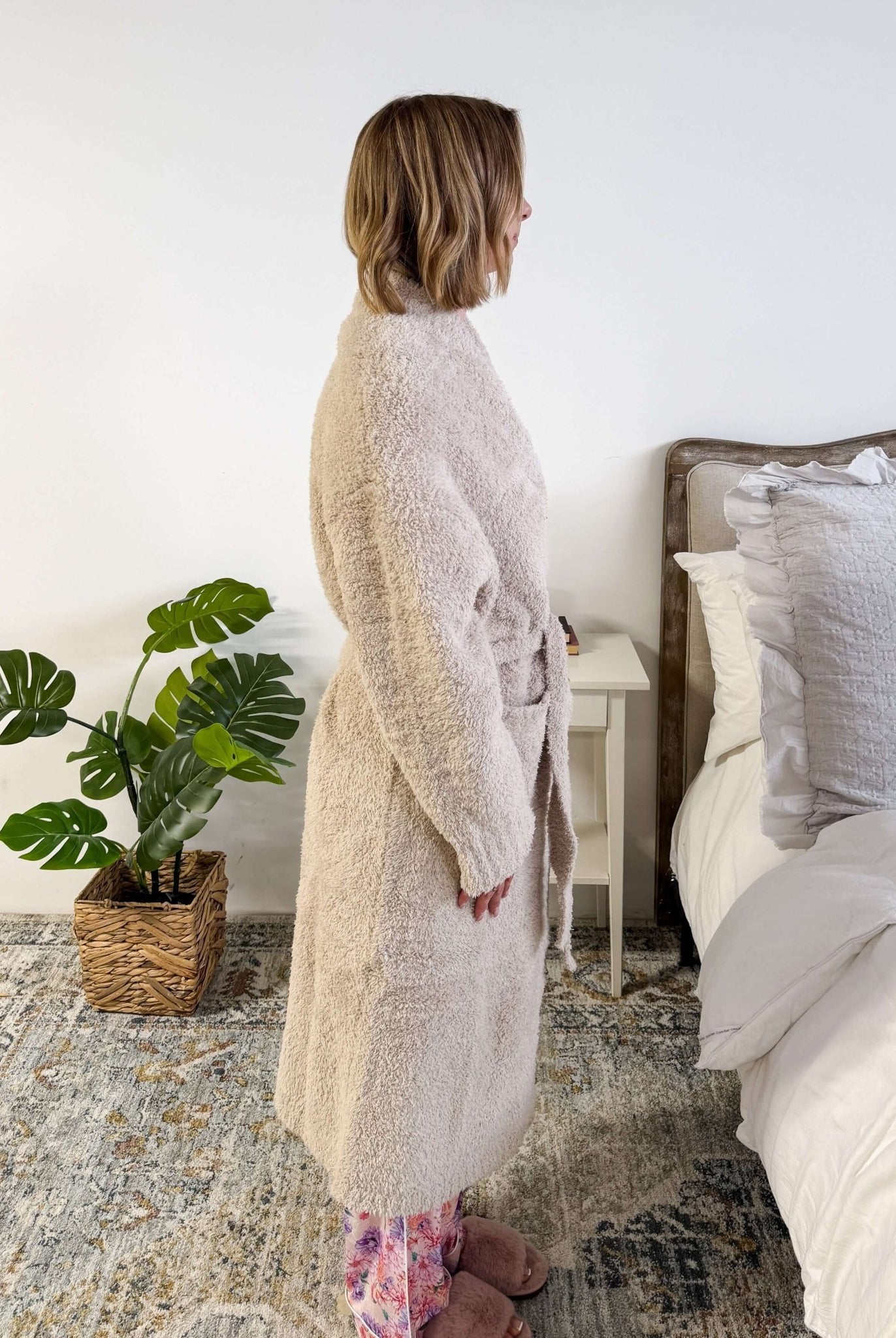 Sand Beige Chenille Cloud Spa Robe – Plush Stretch Robe with Pockets side profile shot on model standing in a bedroom setting