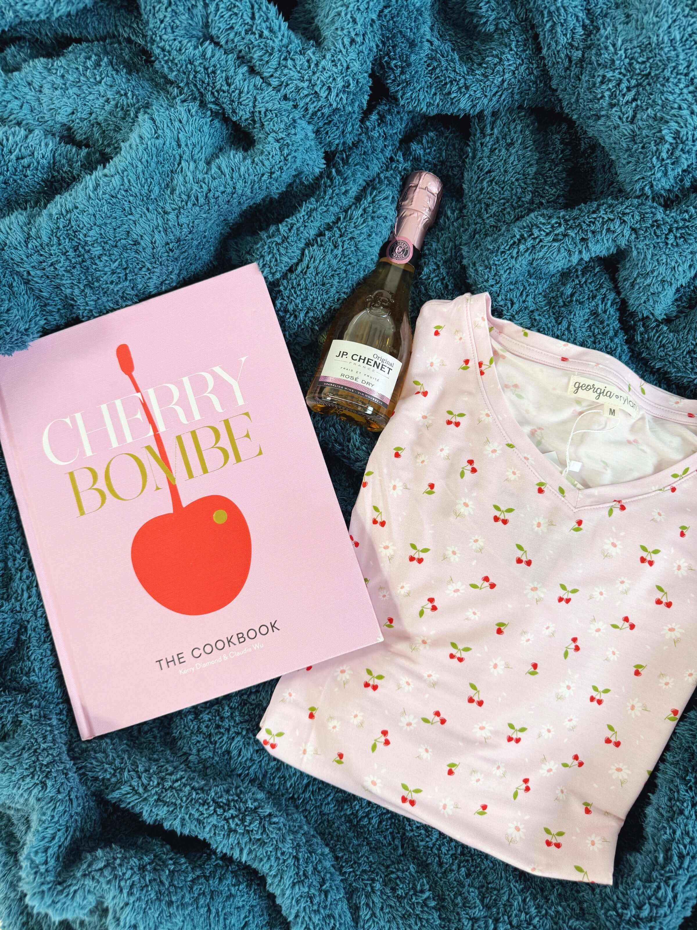 Cozy Cabin Blanket in Peacock Blue on bed