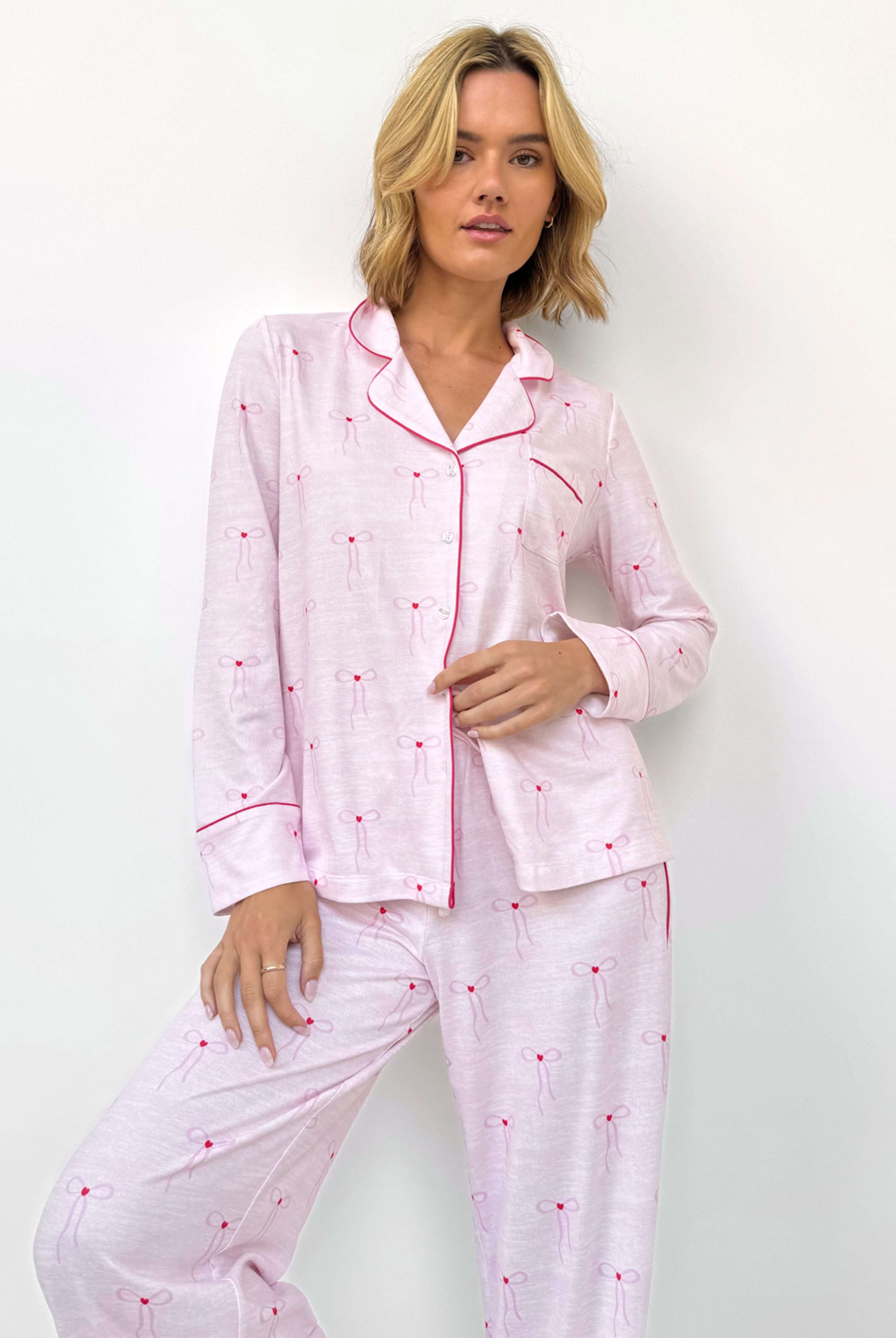 Flora Pillowsoft Sleep Set Splendid featuring silky soft button-down pajamas in pink with patterned bow details.