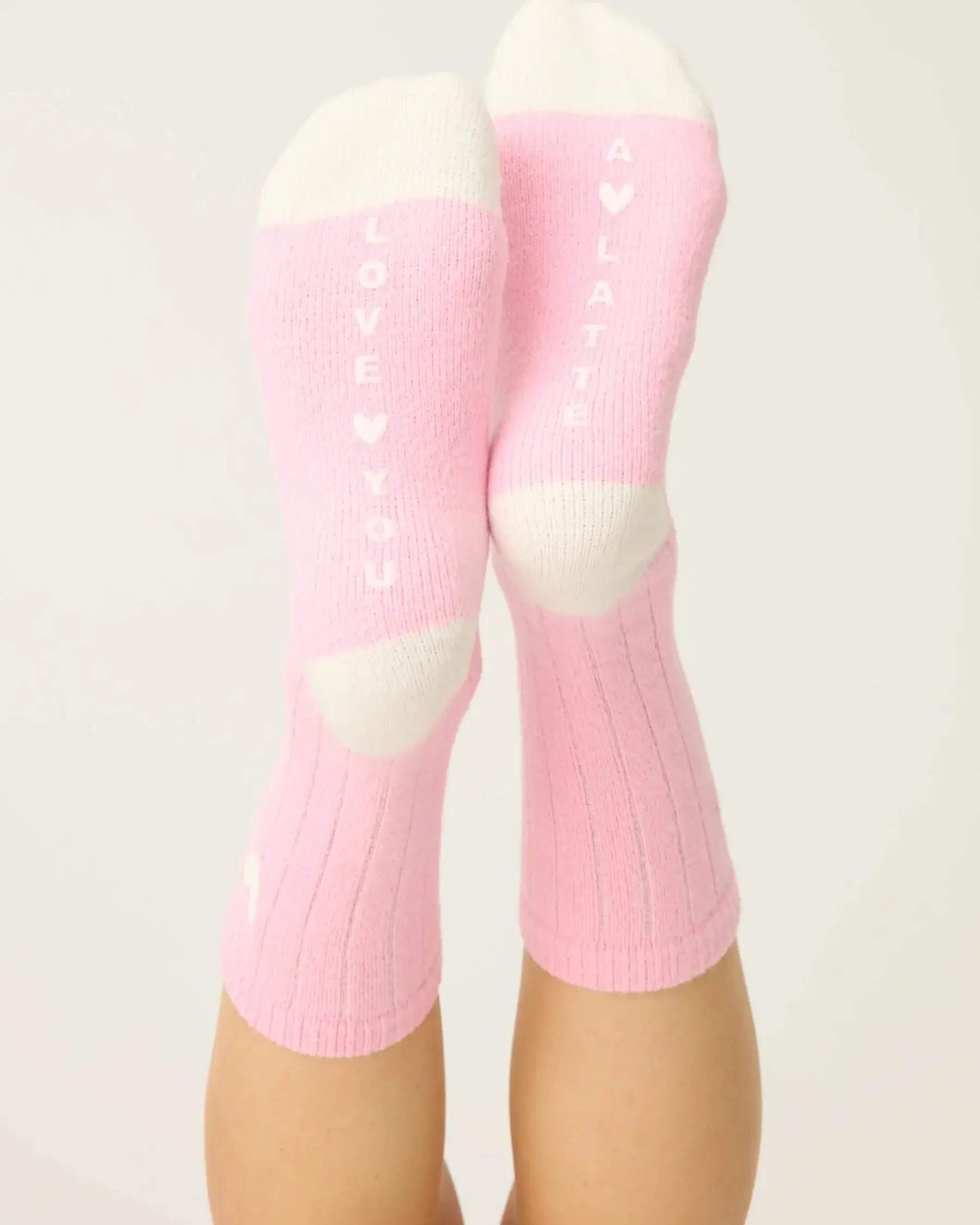 Pair of PJ Salvage Bright Pink Love you Latte Crew Socks with a white contrast toe and heel, showing the sweet heart graphic above the ankle.