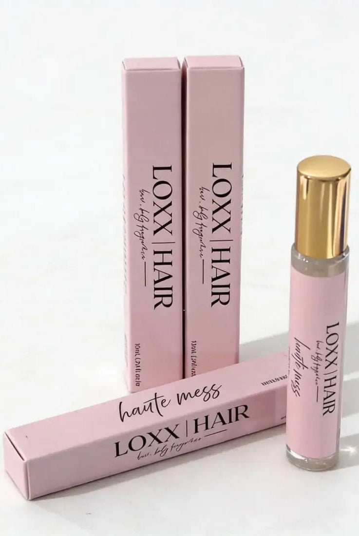LOXX Haute Mess Hair & Body Fragrance – 10mL travel size with elegant pink packaging and gold cap displayed.