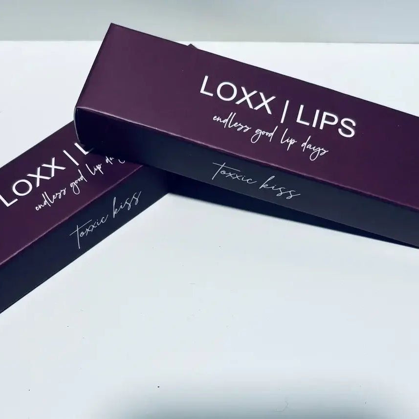 LOXX LIPS Peptide Lip Gloss Toxxic Kiss Berry Tint packaging on a clean background.