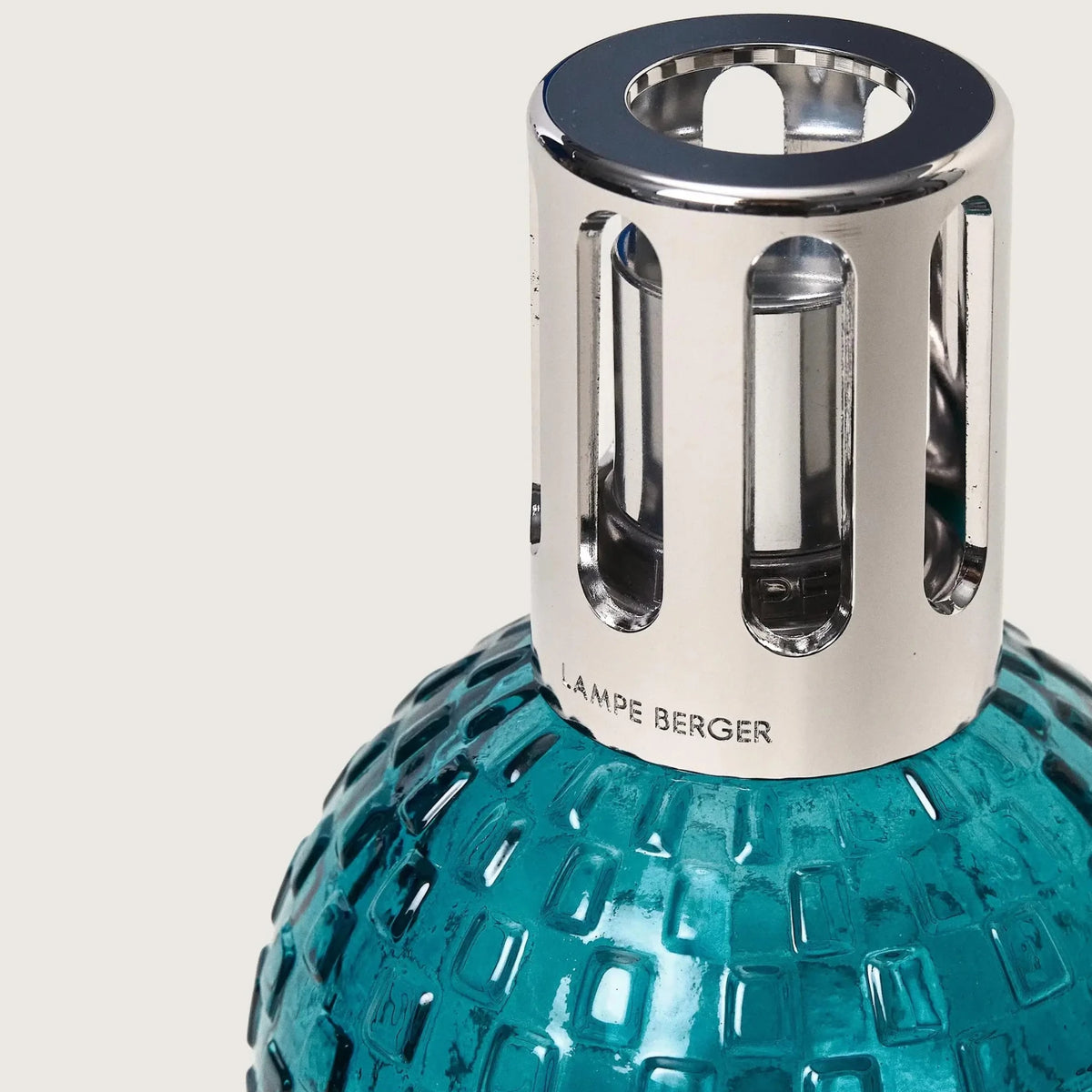 Maison Berger Disco Lamp Teal Green with Ocean Breeze fragrance bottle close-up — Cloud Nine Pajamas