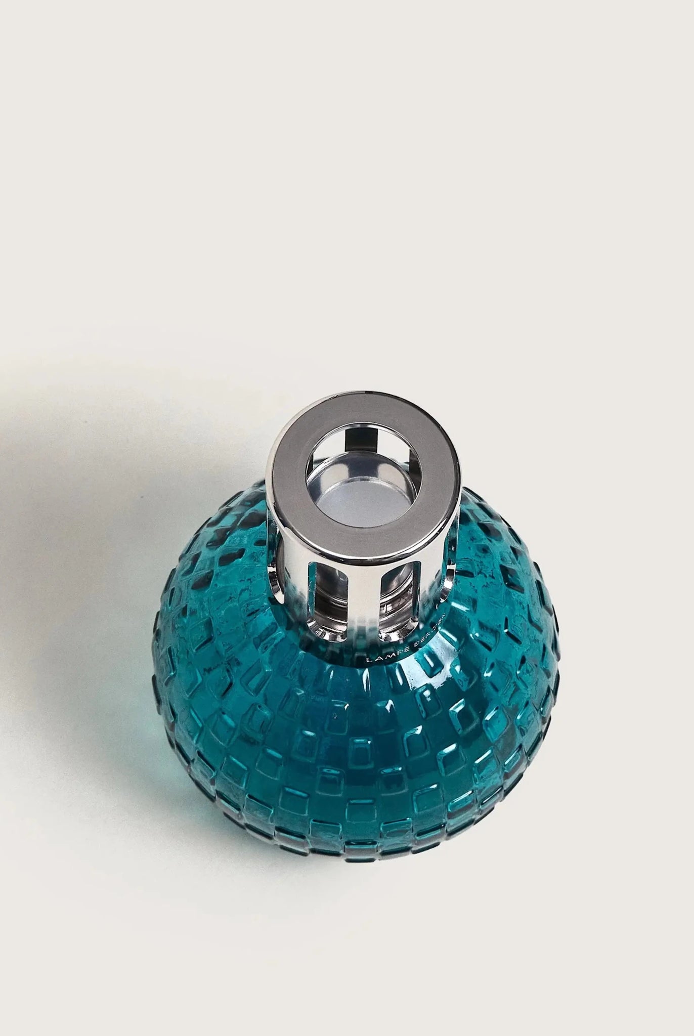 Maison Berger Paris Disco Fragrance Lamp Gift Set featuring a teal lamp and fragrance bottle. showing top of bottle
