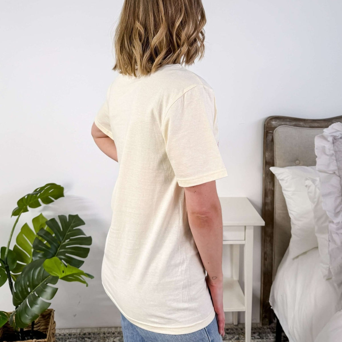 Cream Crew Fit Graphic Tee side profile on model