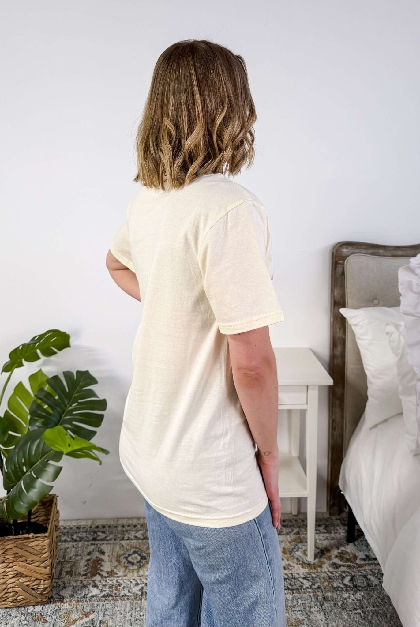 Cream Crew Fit Graphic Tee side profile on model