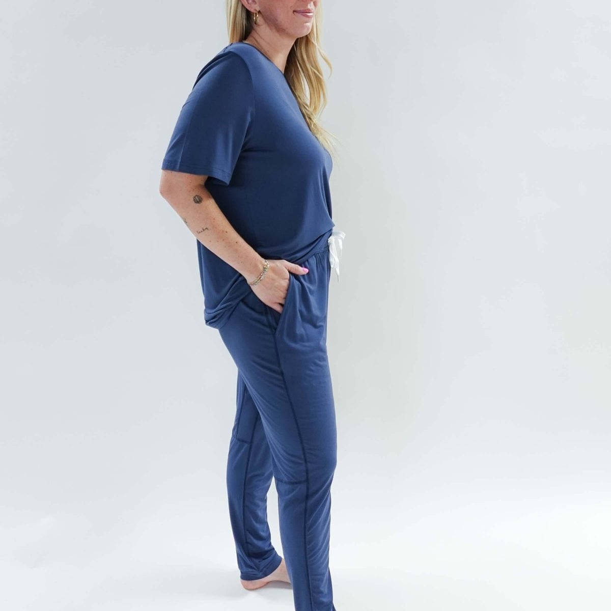 Model wearing Denim Blue Unisex Bamboo Jogger from Bob's Sleepwear Co., showcasing comfort and style.