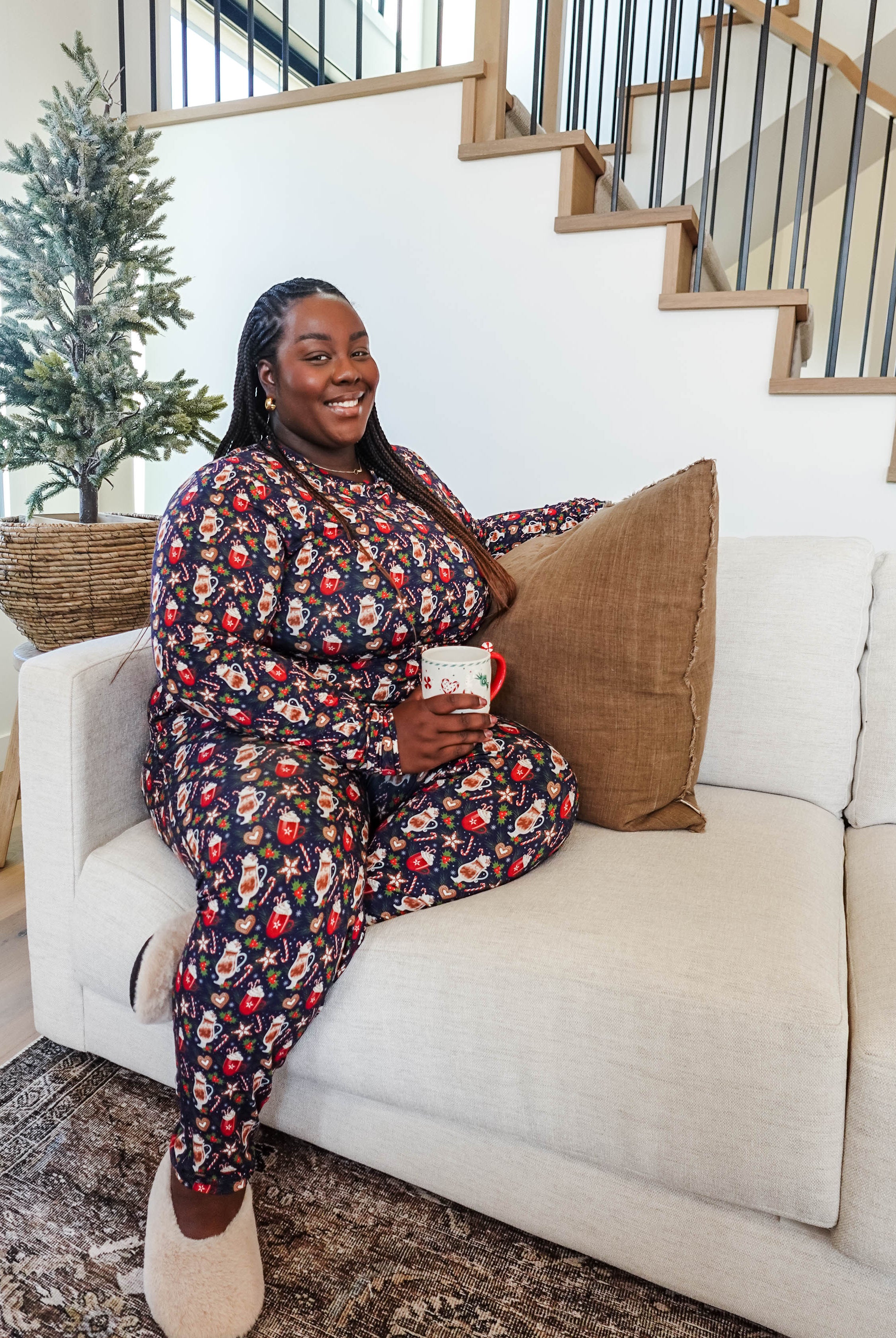 Merry Mugs Print Long Sleeve & Jogger Bamboo PJ Set by Georgia Rylan - plus size model on couch showing the cozy nature