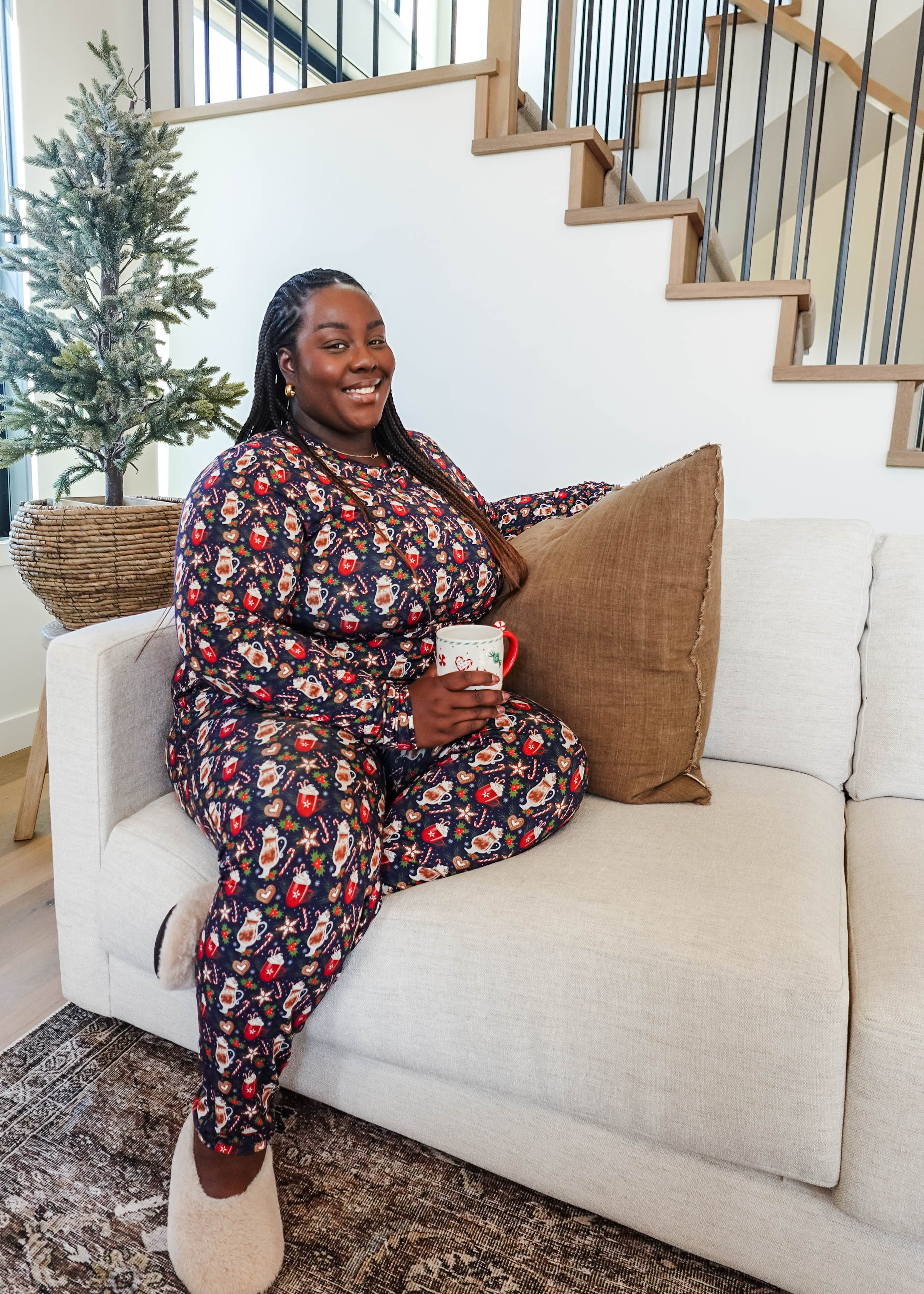Merry Mugs Print Long Sleeve & Jogger Bamboo PJ Set by Georgia Rylan - plus size model on couch showing the cozy nature