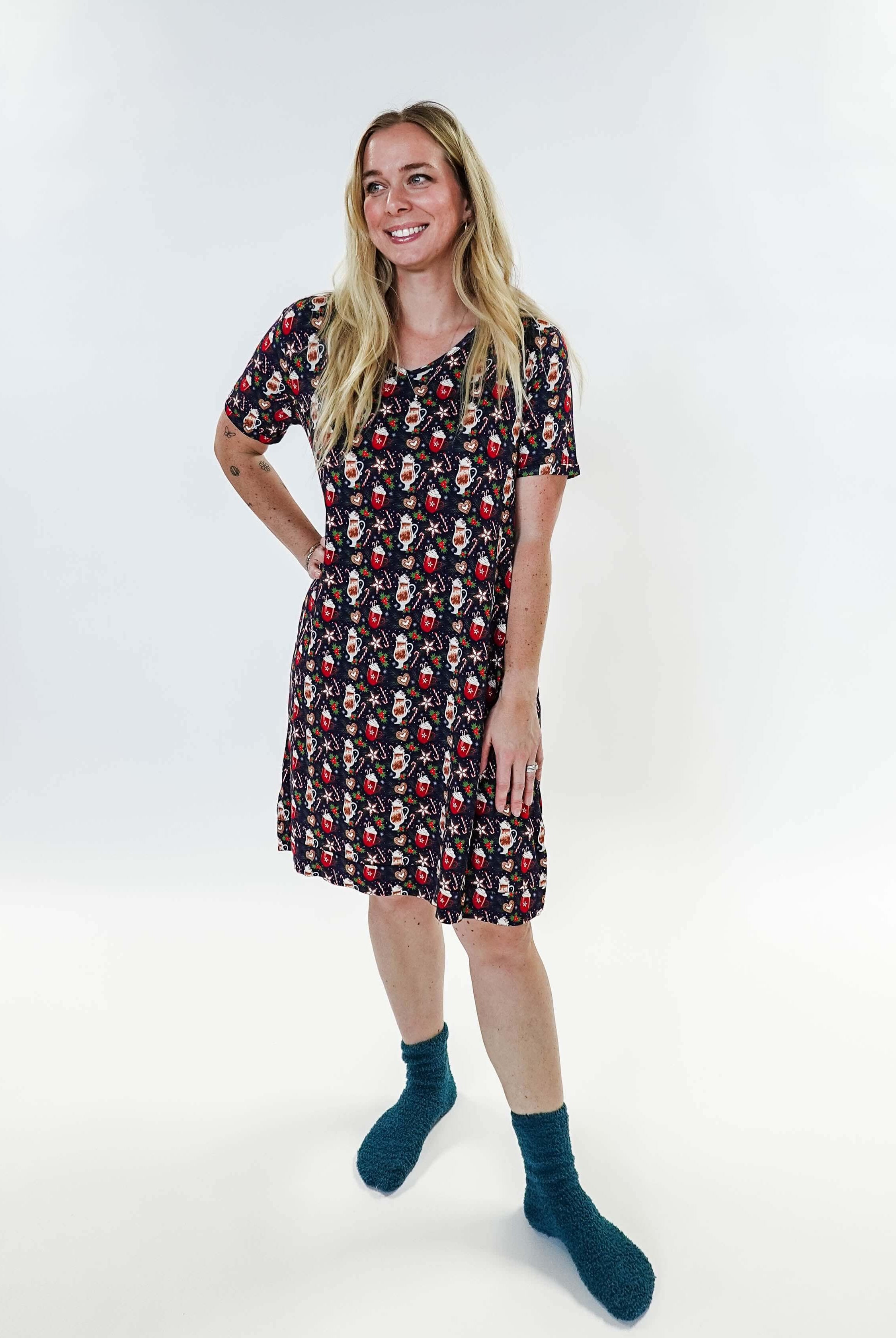 Merry Mugs V-Neck Bamboo Nightshirt featuring a whimsical holiday print, modeled by a woman standing with a cheerful expression.