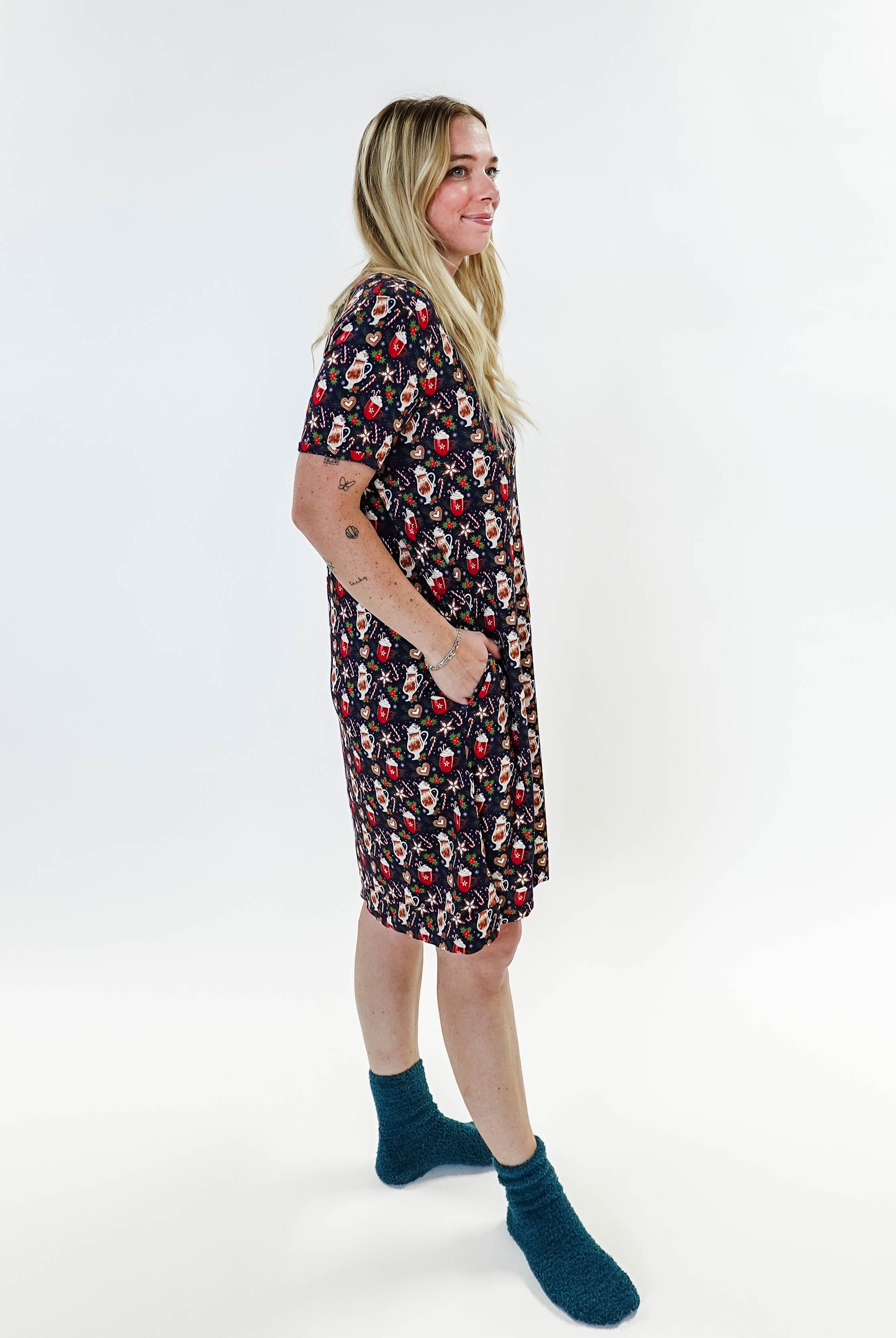 Merry Mugs V-Neck Bamboo Nightshirt featuring a whimsical holiday print, modeled by a woman standing with a cheerful expression.