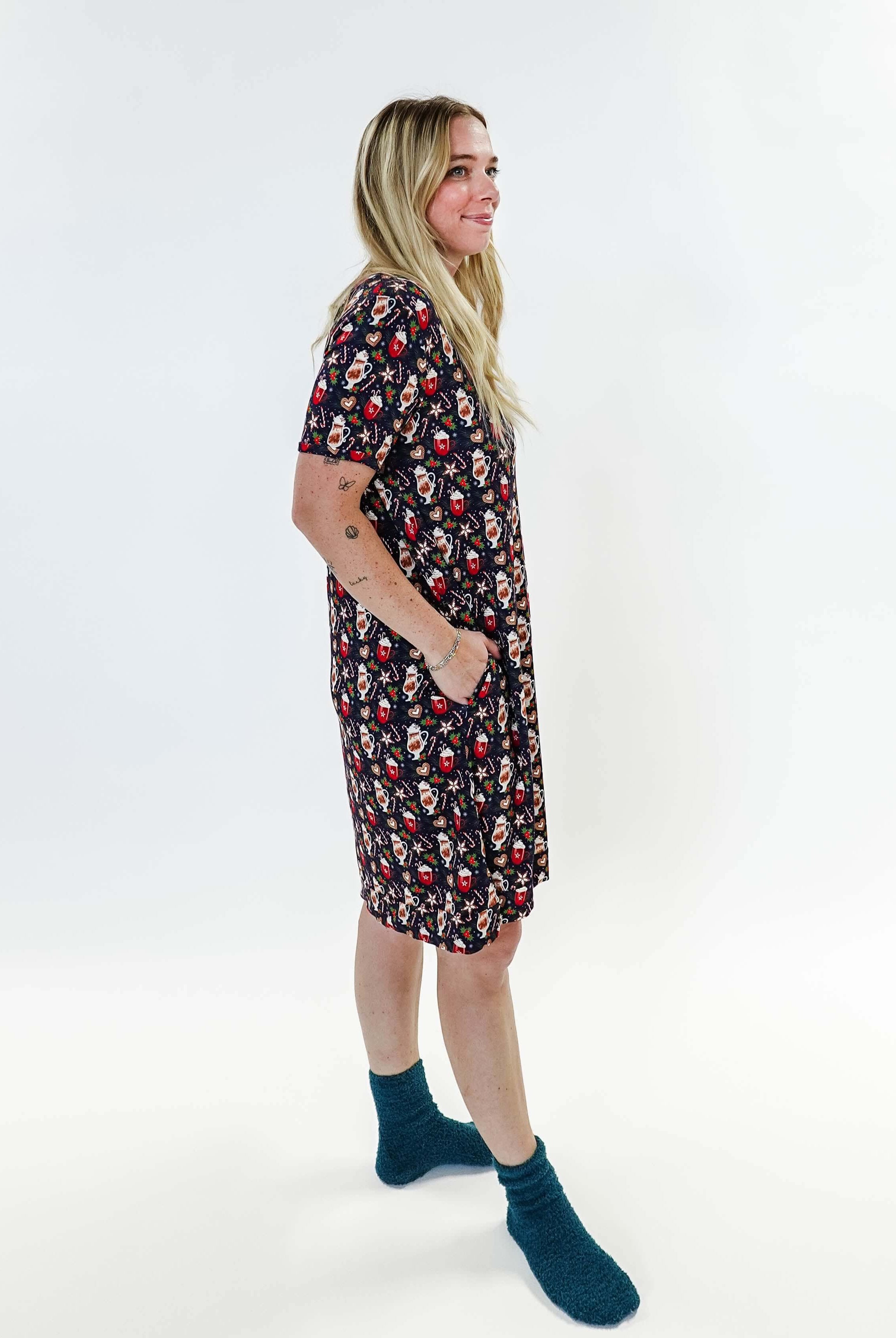 Merry Mugs V-Neck Bamboo Nightshirt featuring a whimsical holiday print, modeled by a woman standing with a cheerful expression.