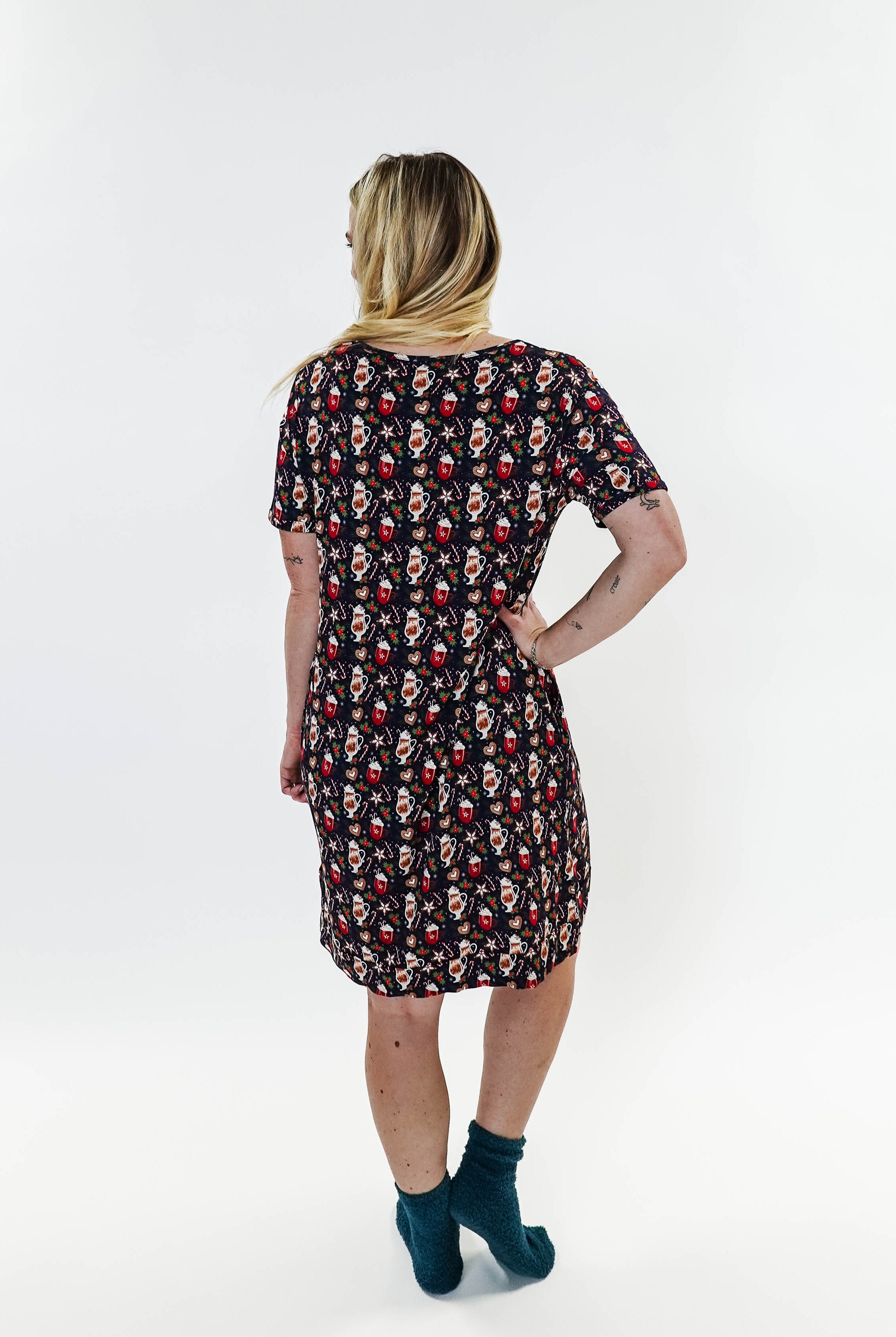 Merry Mugs V-Neck Bamboo Nightshirt featuring a whimsical holiday print, modeled by a woman standing with a cheerful expression.