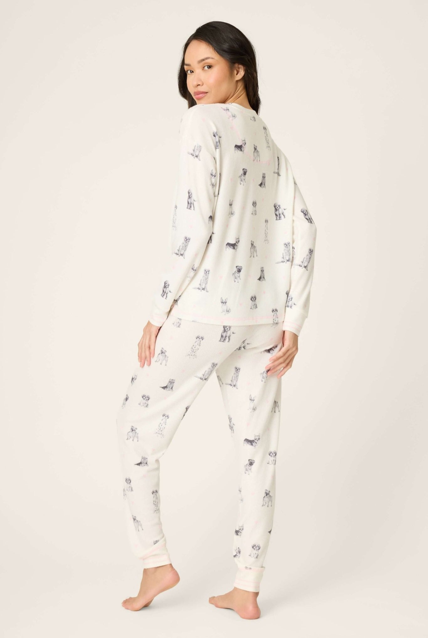 Woman wearing My Dog is my Valentine Peachy Jersey Jogger Set PJ Salvage, showcasing playful dog print and relaxed fit.