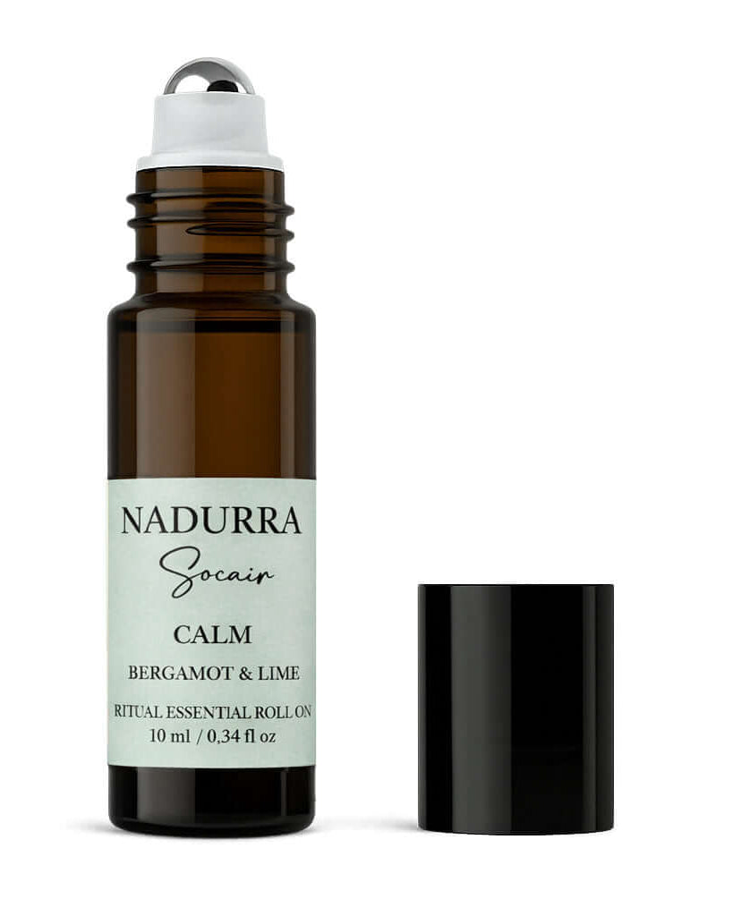 Roll-on bottle of Nadurra Socaer Calm Bergamot & Lime essential oil on a white background