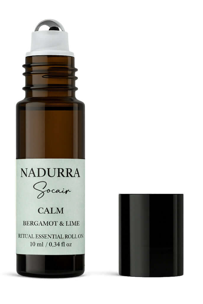Roll-on bottle of Nadurra Socaer Calm Bergamot & Lime essential oil on a white background