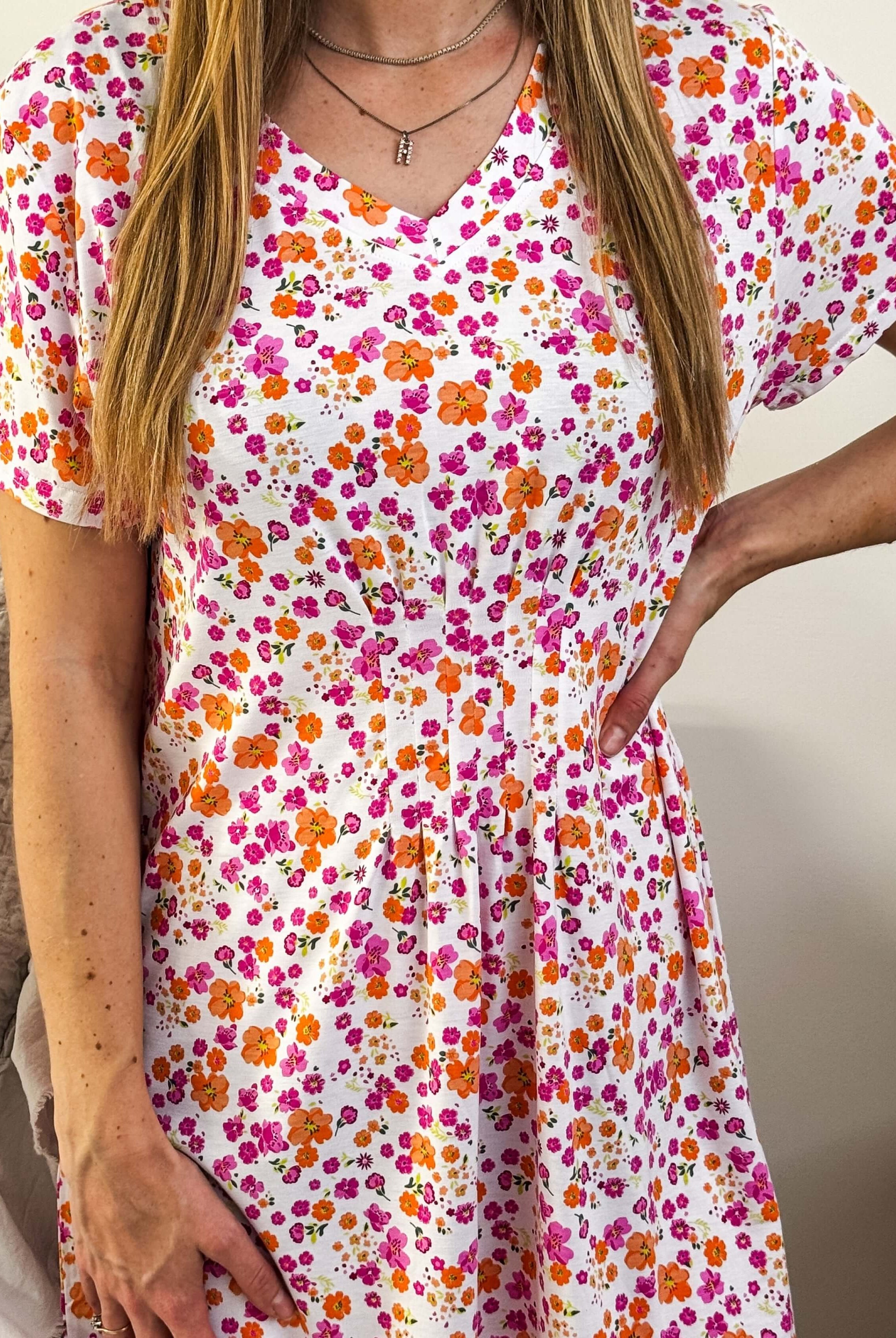 Close-up of the nightshirt fabric, showcasing the V-neck and the 7 seam pintuck detail below the chest.