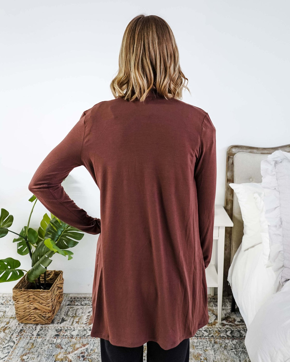 Person wearing a brown long-sleeve cardigan in a bedroom setting Scarlett Ellie Summer Open Lightweight Cardigan | Cloud Nine Pajamas