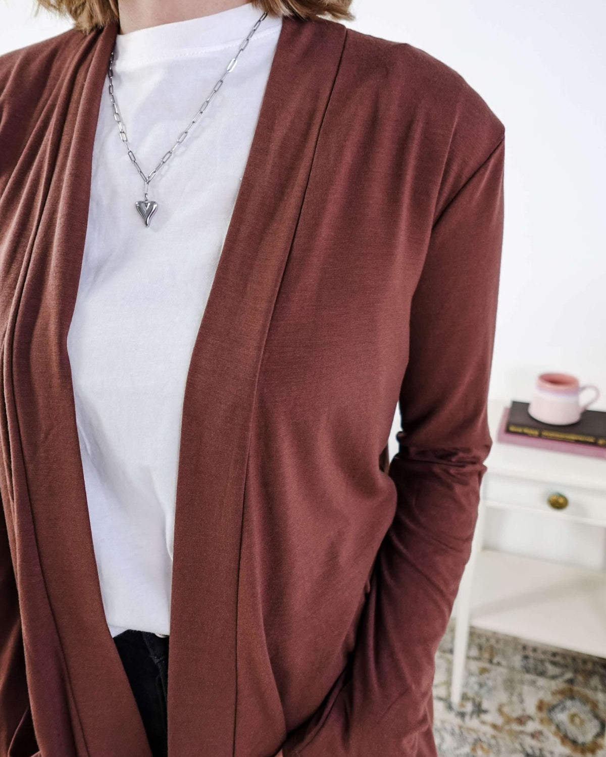 Person wearing a brown cardigan over a white shirt with a blurred background Scarlett Ellie Summer Open Lightweight Cardigan | Cloud Nine Pajamas
