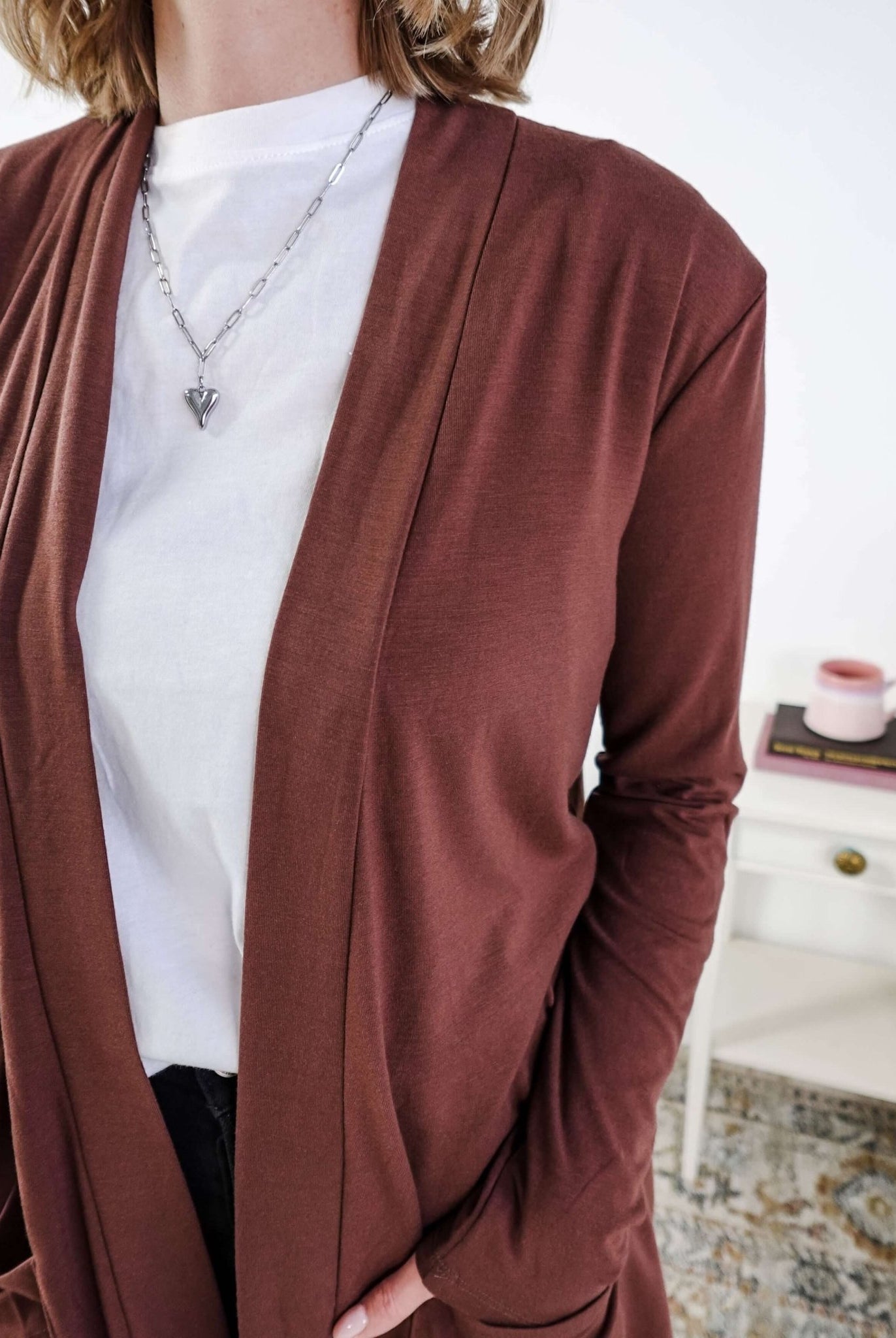 Person wearing a brown cardigan over a white shirt with a blurred background Scarlett Ellie Summer Open Lightweight Cardigan | Cloud Nine Pajamas