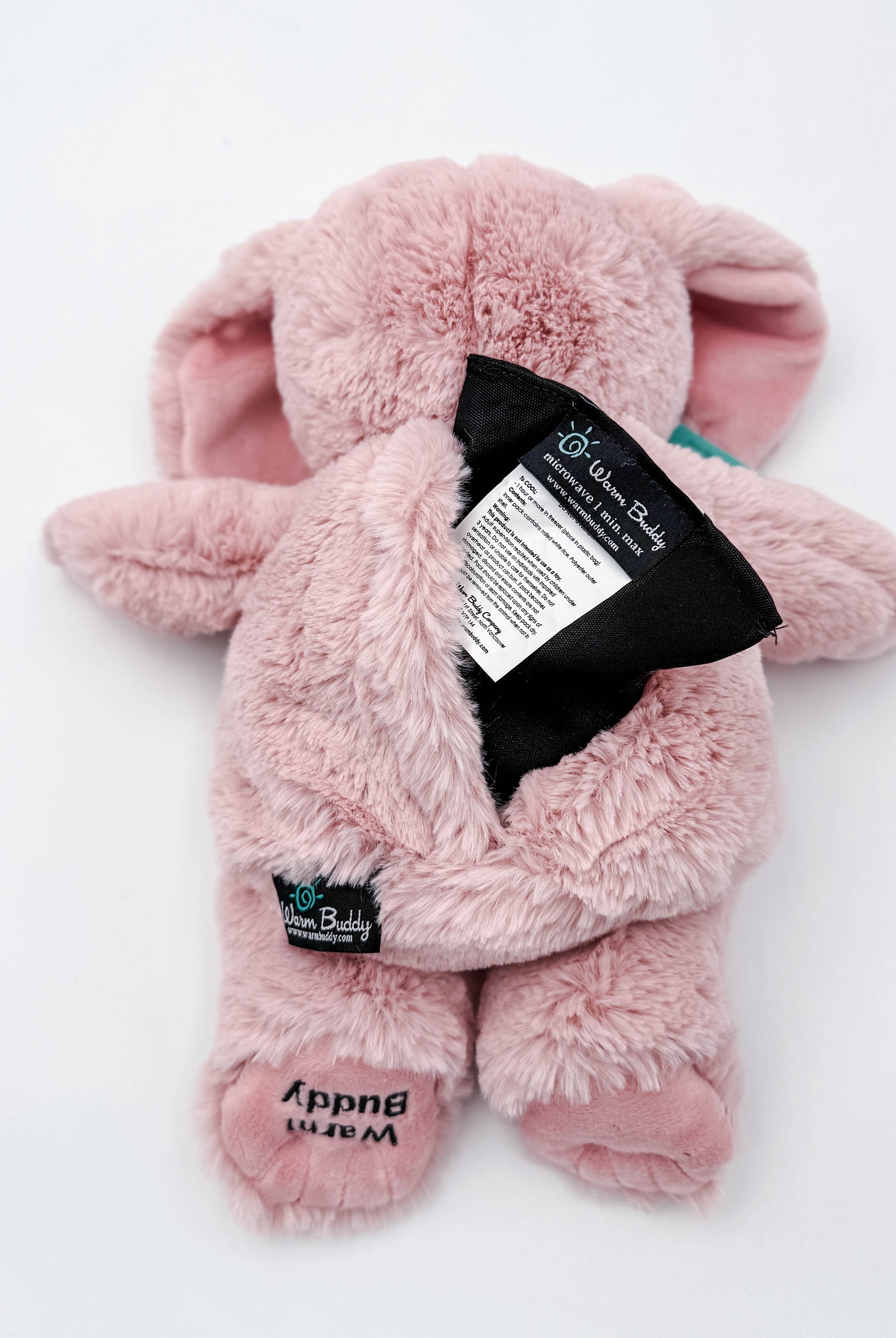 Cuddle Buddy Pink Bunny pink plush bunny from warm buddy with heating pack for moist therapy - showing microwaveable pack and opening
