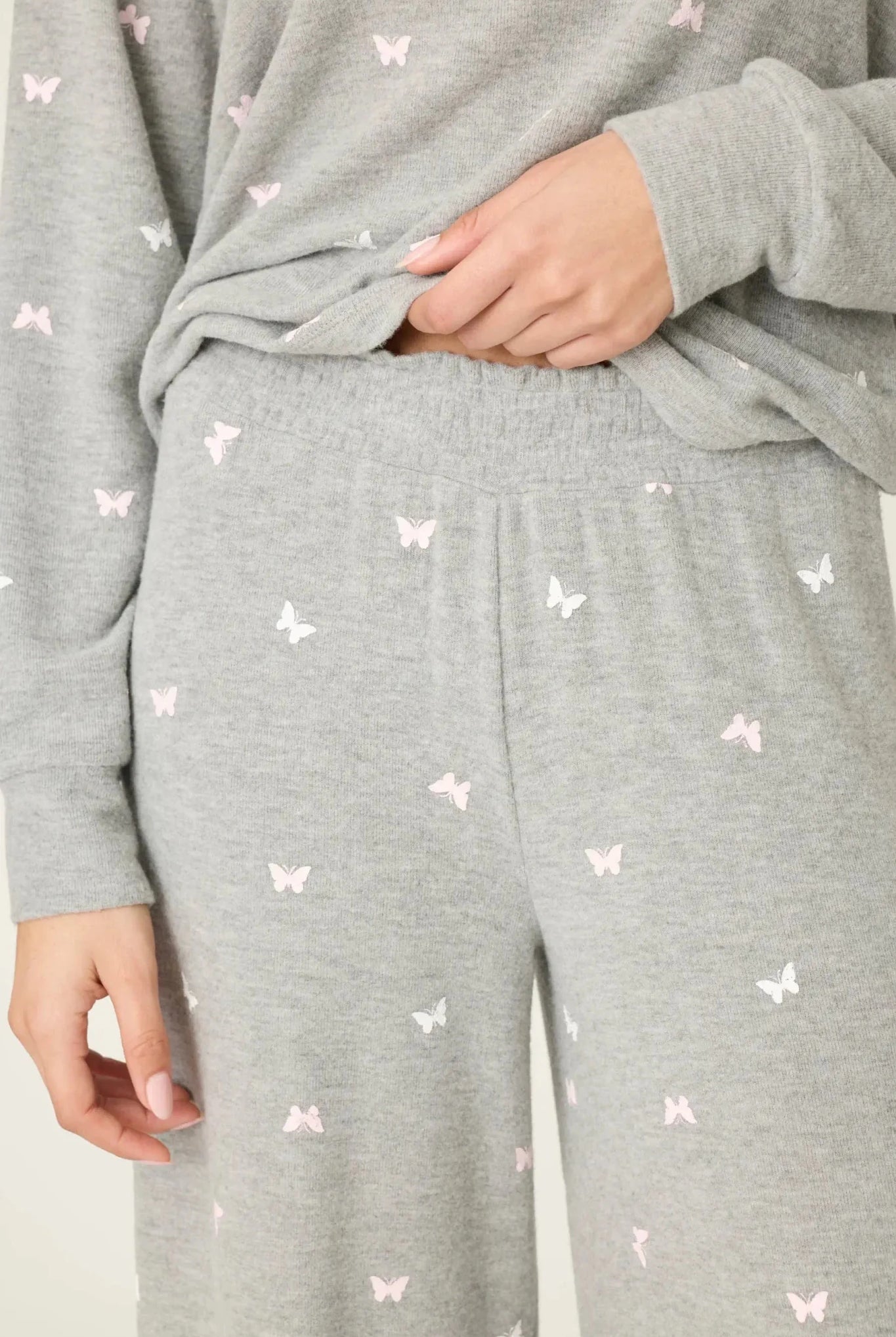 PJ Salvage Peachy Butterfly Kisses Lounge Set featuring soft grey fabric with pink butterfly prints and relaxed wide-leg pants.
