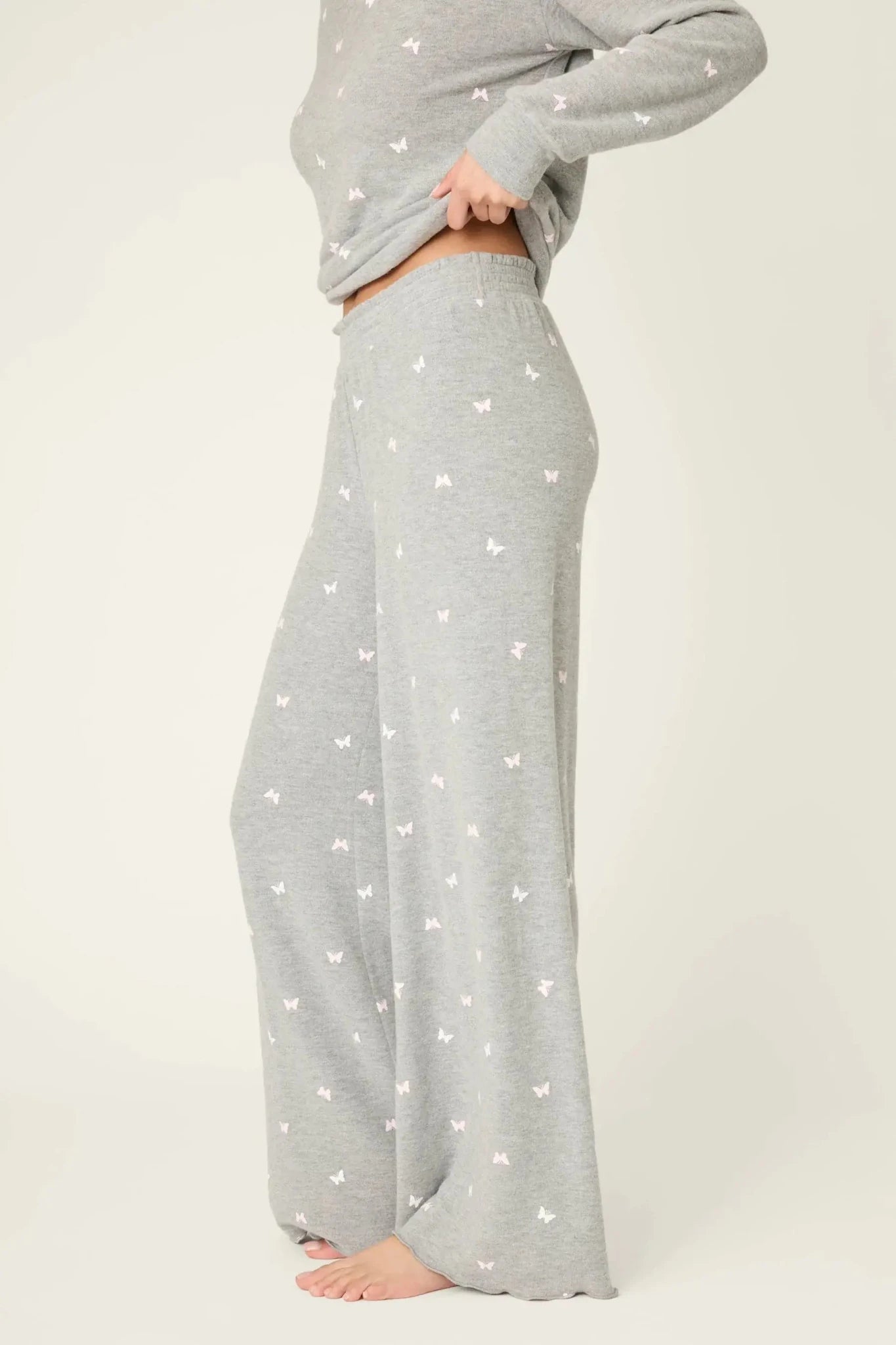 PJ Salvage Peachy Butterfly Kisses Lounge Set featuring soft grey fabric with pink butterfly prints and relaxed wide-leg pants.