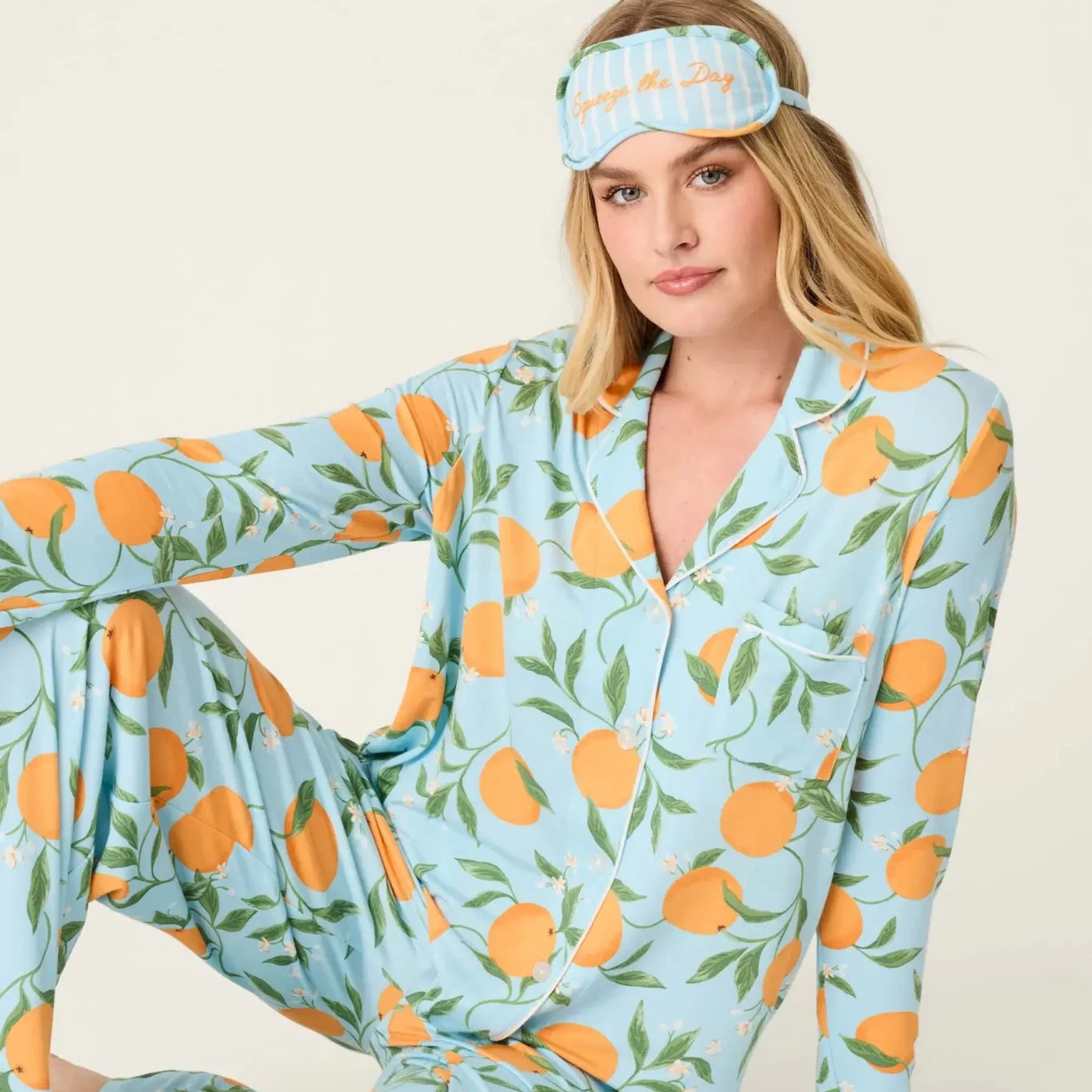 Model wearing PJ Salvage Citrus Dreams 3-Piece PJ Set featuring orange design with matching eye mask.