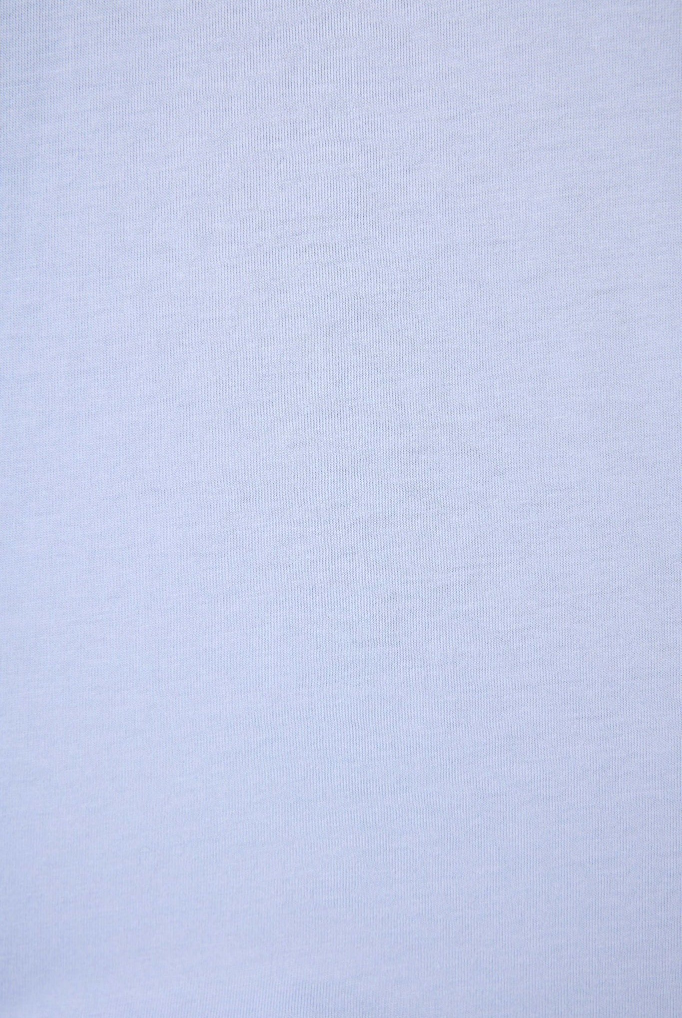 PJ SALVAGE Graphic Print Softee Tee & Short Lounge Set in "Nap Time is my Happy Hour" graphic tee shirt in light blue. Close up of the Fabric showing texture and colour of the softee set