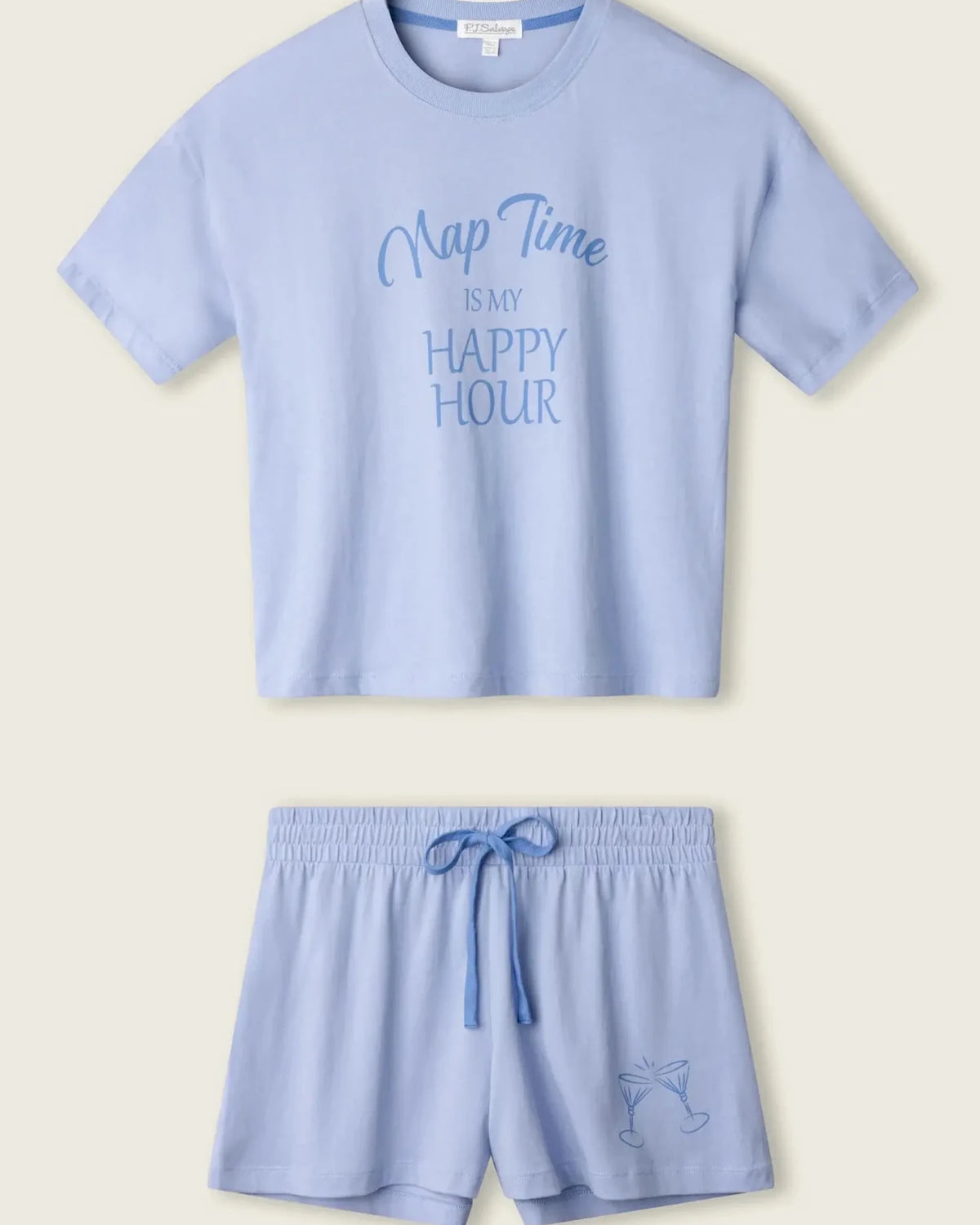PJ SALVAGE Graphic Print Softee Tee & Short Lounge Set in "Nap Time is my Happy Hour" graphic tee shirt in light blue. Product lay flat on a light background shot