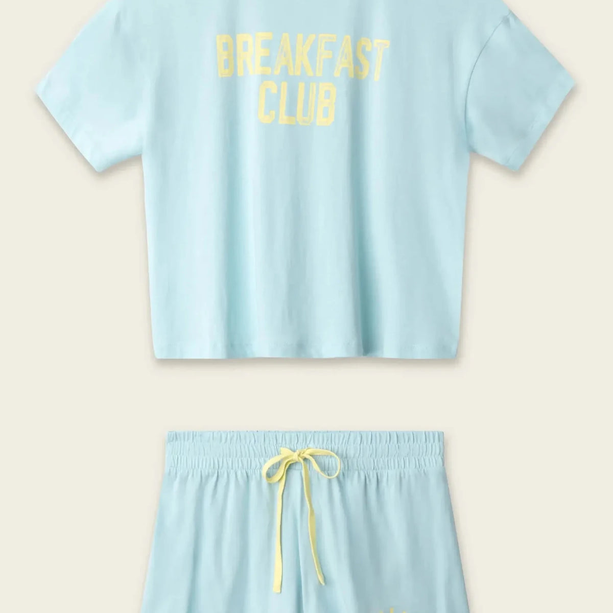 PJ SALVAGE Graphic Print Softee Tee & Short Lounge Set in "Breakfast Club" graphic tee shirt in light blue. Flat lay of product against a light background