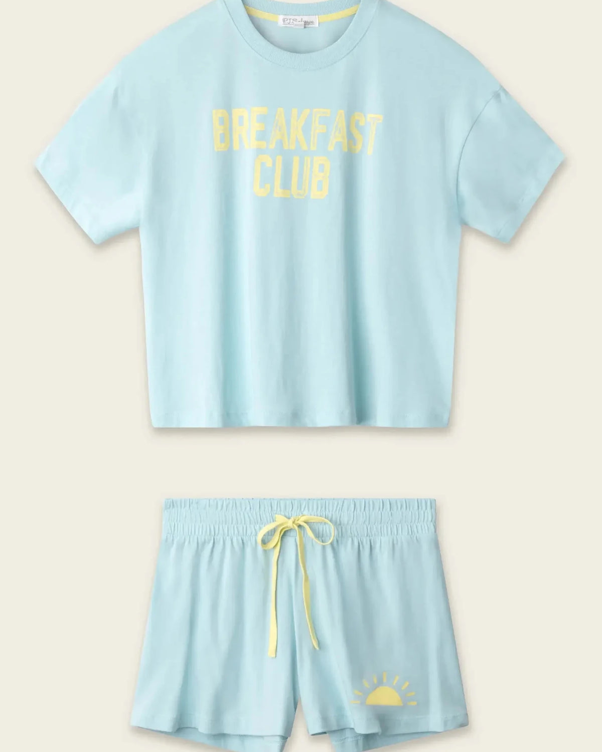 PJ SALVAGE Graphic Print Softee Tee & Short Lounge Set in "Breakfast Club" graphic tee shirt in light blue. Flat lay of product against a light background