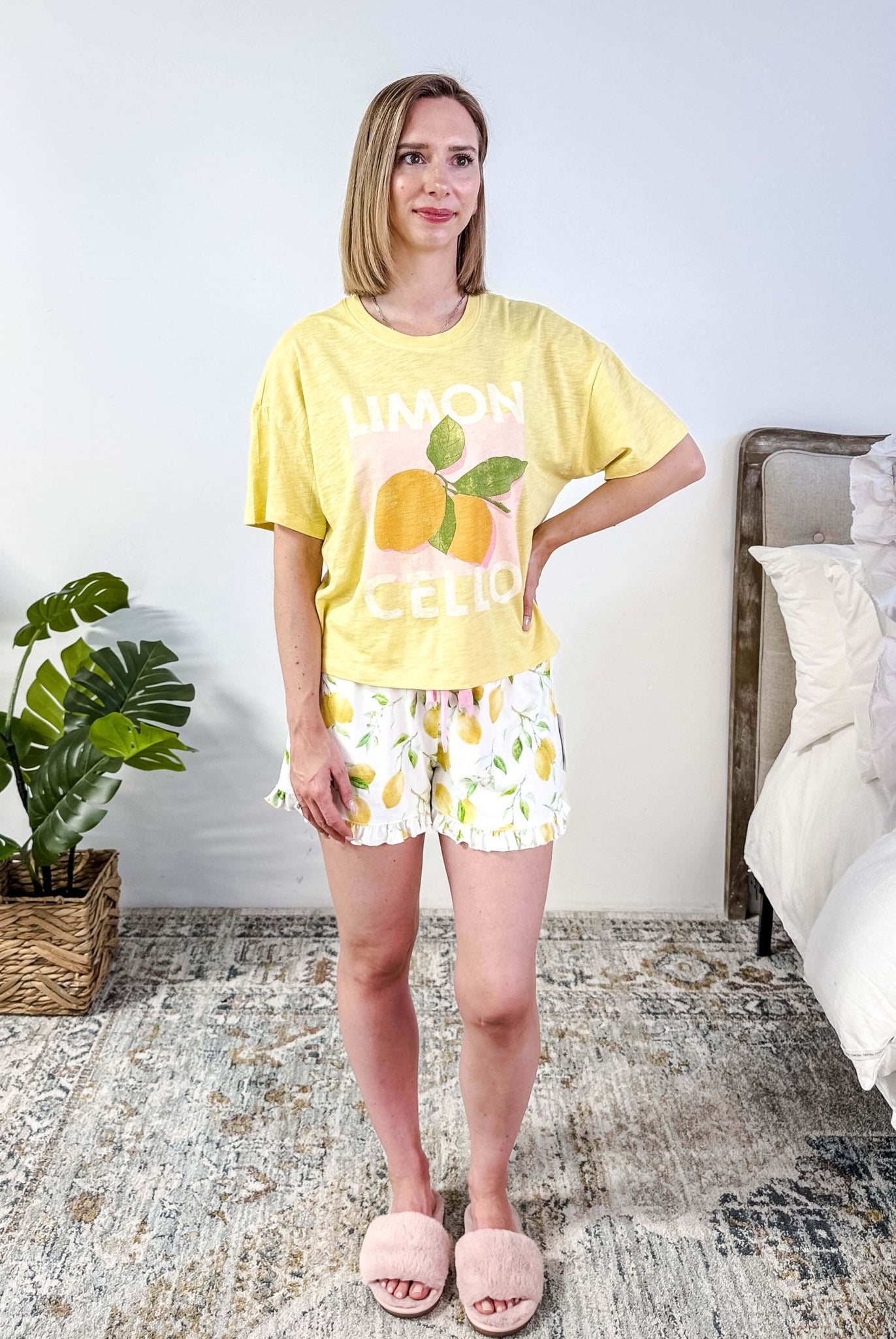 PJ SALVAGE — La Dolce Spritz Limoncello Graphic Tee & Lemon Zest Short Set shown on model in bedroom setting, full length shot