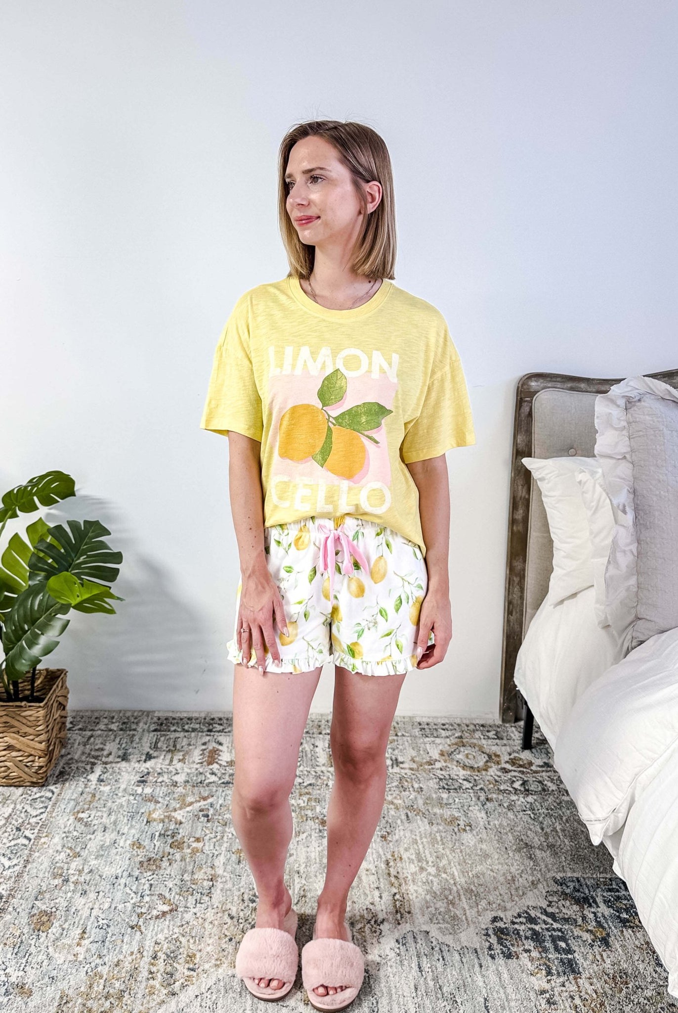 PJ SALVAGE — La Dolce Spritz Limoncello Graphic Tee & Lemon Zest Short Set shown on model in bedroom setting, full length shot of front