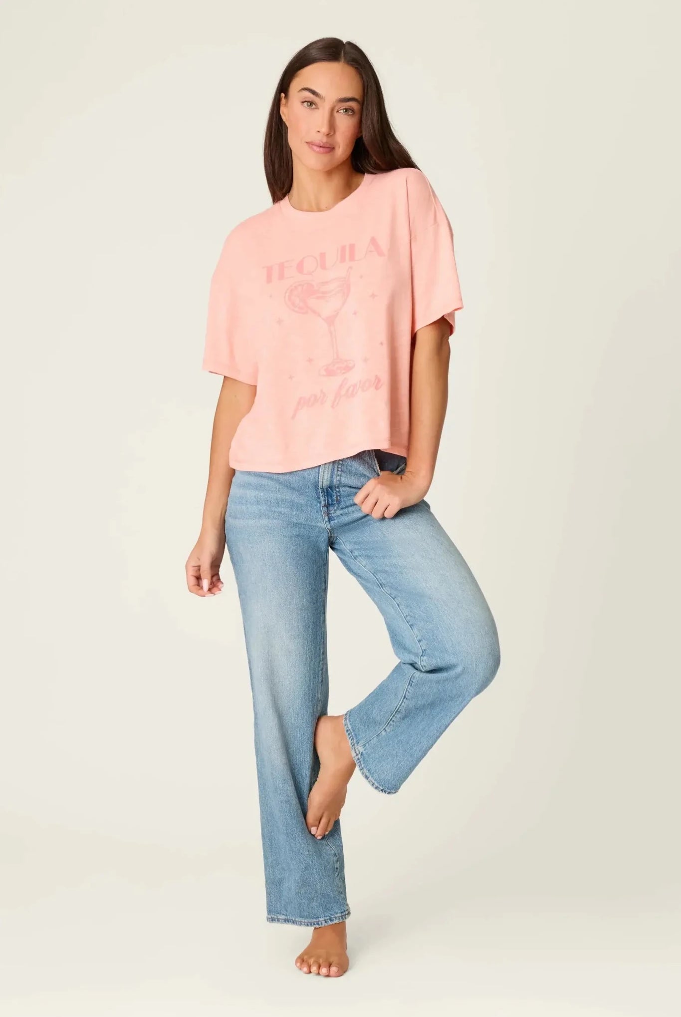 Model wearing PJ Salvage Paloma Mama "Tequila Por Favor" Graphic Tee in light pink with a cocktail graphic. full profile of model