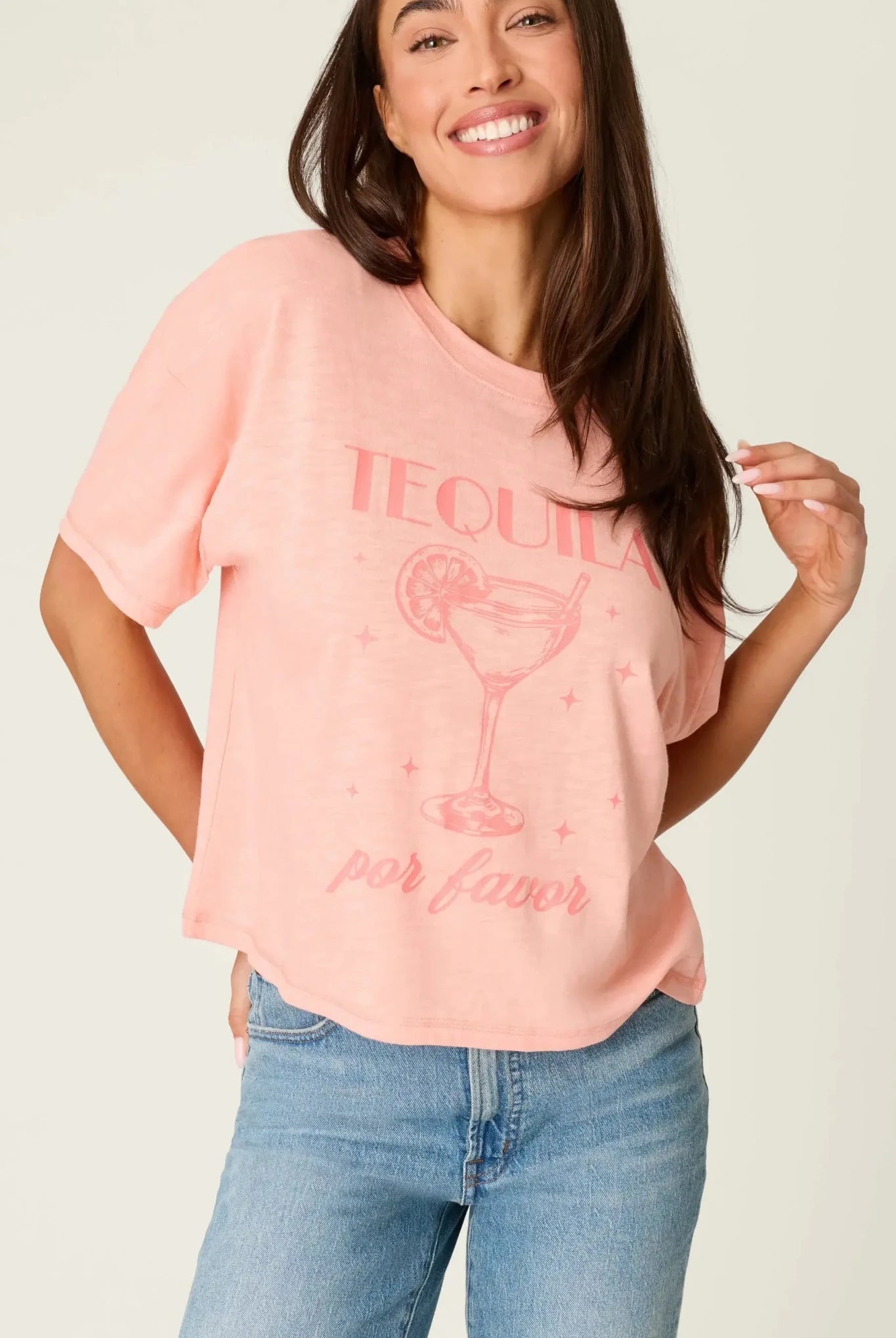 Model wearing PJ Salvage Paloma Mama "Tequila Por Favor" Graphic Tee in light pink with a cocktail graphic.