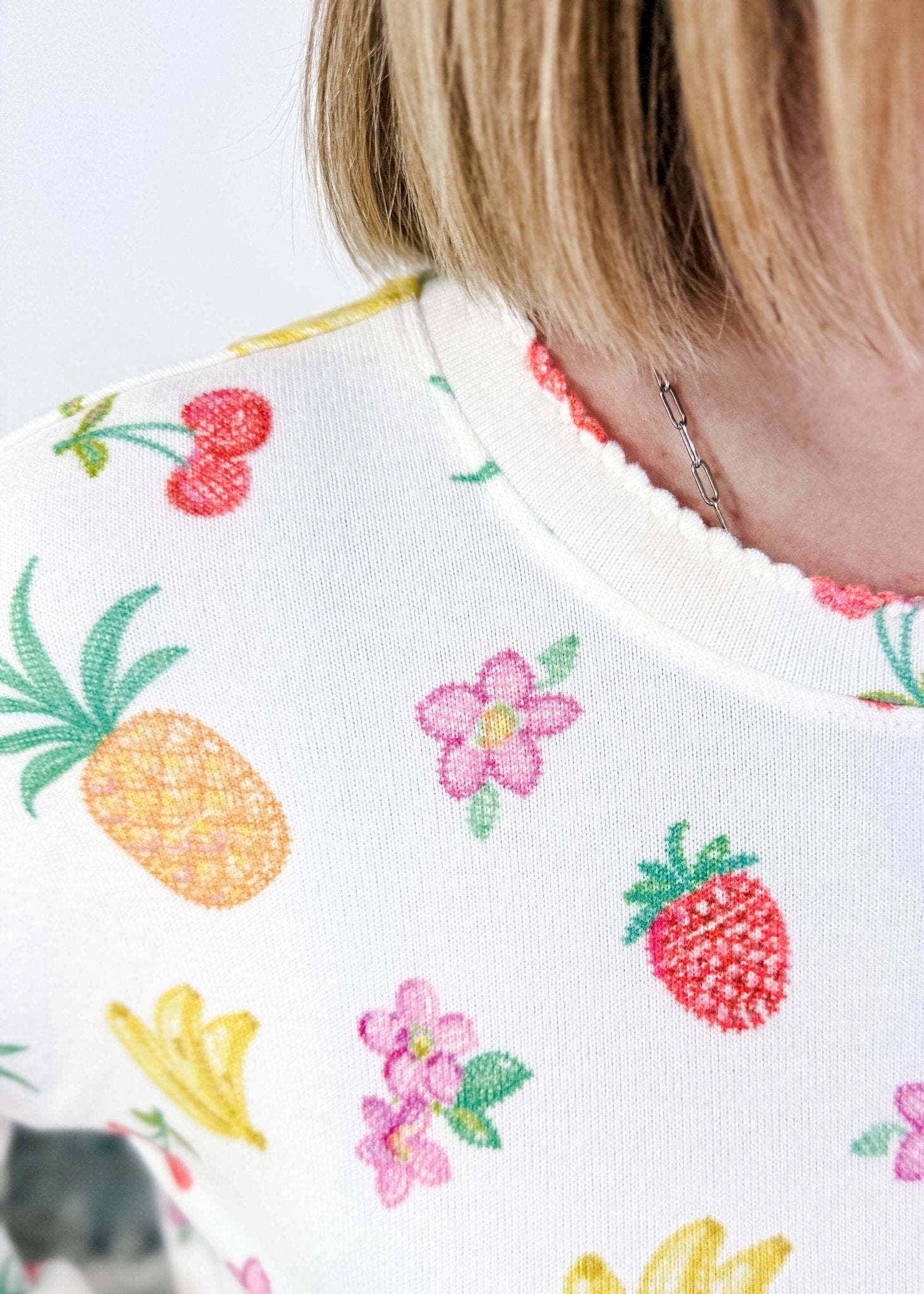 PJ SALVAGE — Viva la Vida Fruit Fiesta Long Sleeve & Pant Set worn on model in a bedroom setting, close up of scalloped detail on collar of the top