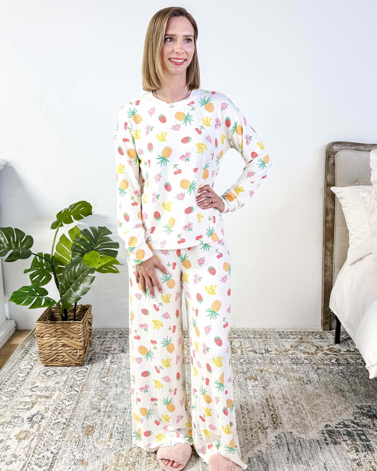 PJ SALVAGE — Viva la Vida Fruit Fiesta Long Sleeve & Pant Set worn on model in a bedroom setting, showing full length of the fruit print pj set