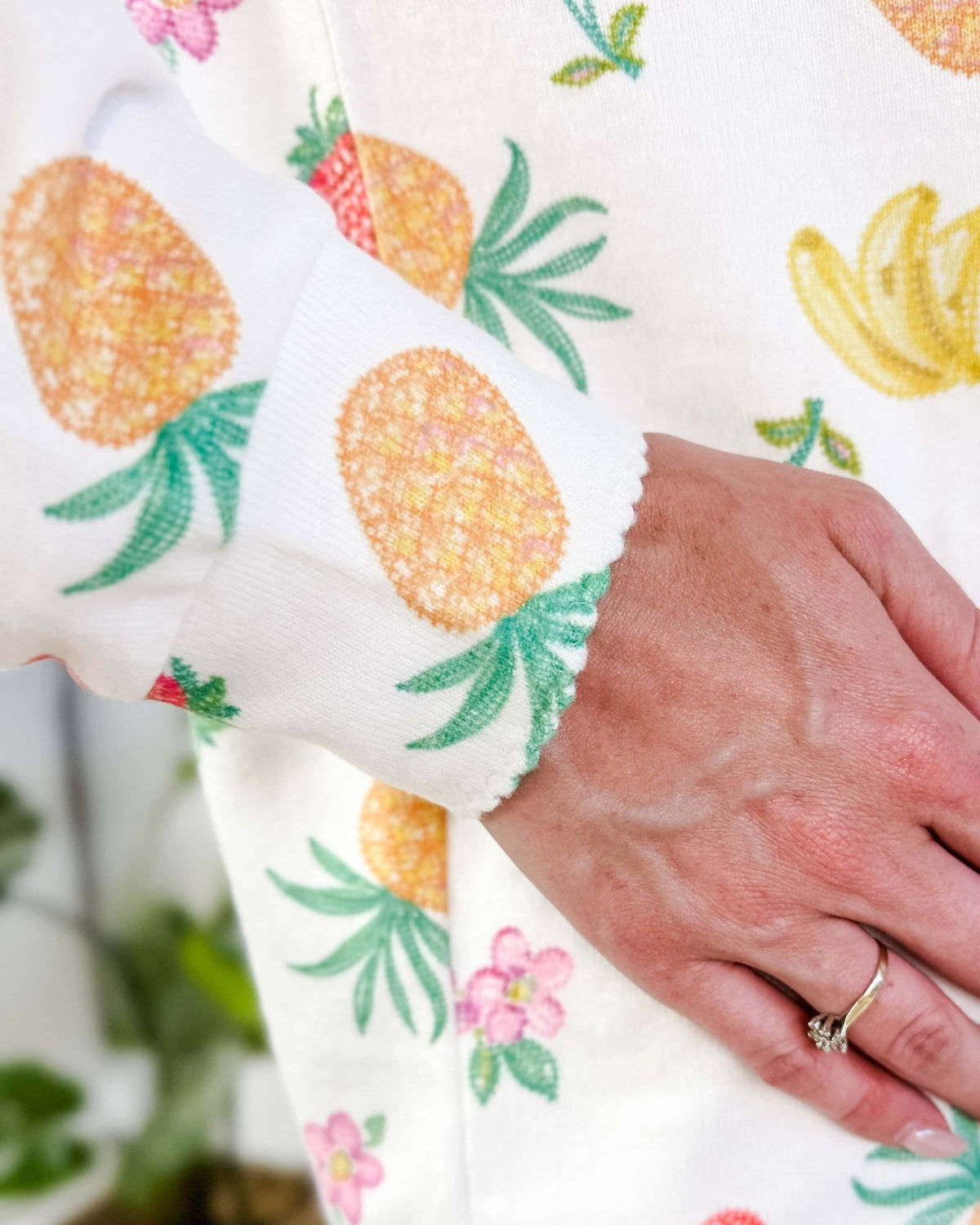 PJ SALVAGE — Viva la Vida Fruit Fiesta Long Sleeve & Pant Set worn on model in a bedroom setting, close up of scalloped detail on cuff of the long sleeve top