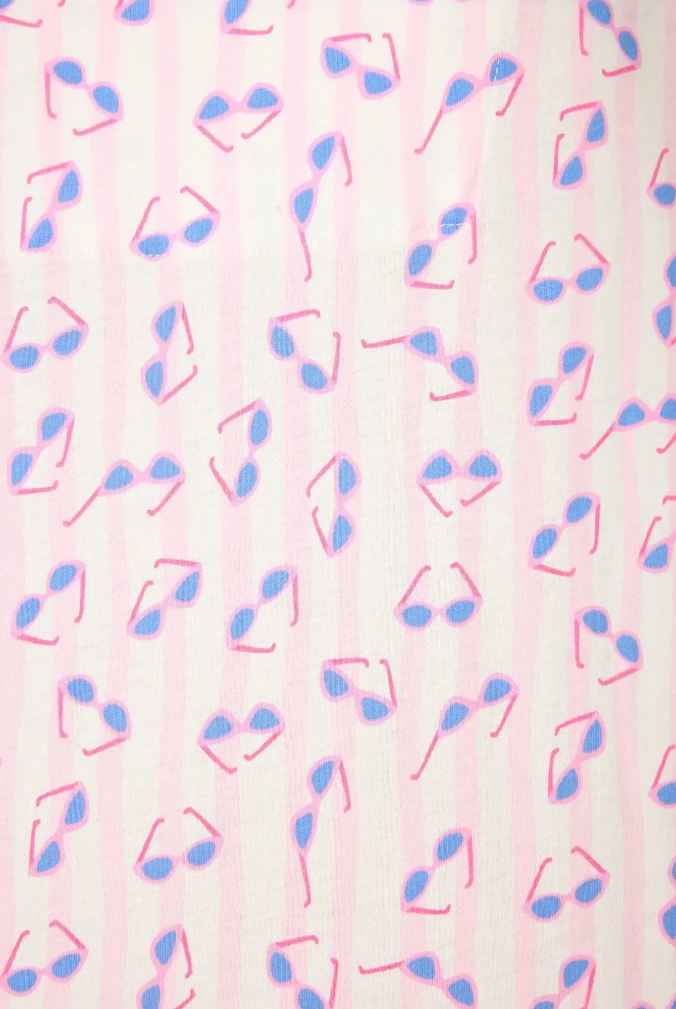 Pattern of pink and blue sunglasses on a striped background, showcasing summer vibes and playful designs.