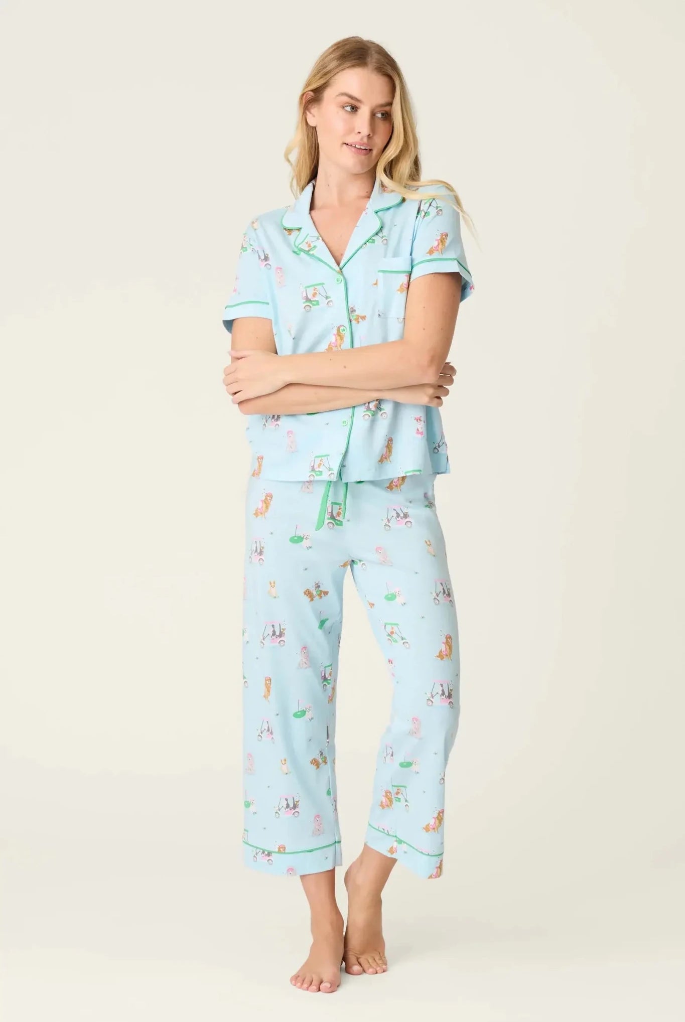 PJ SALVAGE Whimsy Cropped PJ Set in Light Blue Putter Pup print showing dogs golfing. Model stands wearing the set against a light background